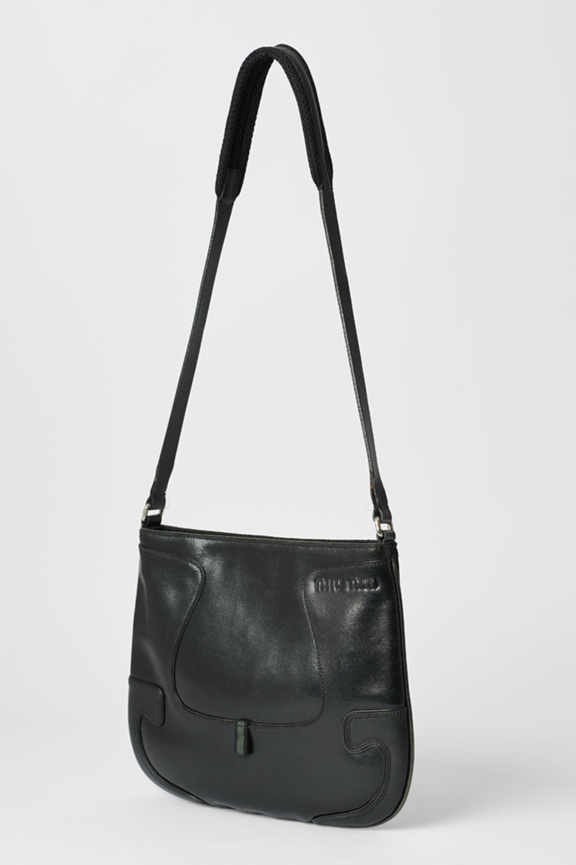 Miu Miu black leather bag with perforated side, to be worn either way. Features 