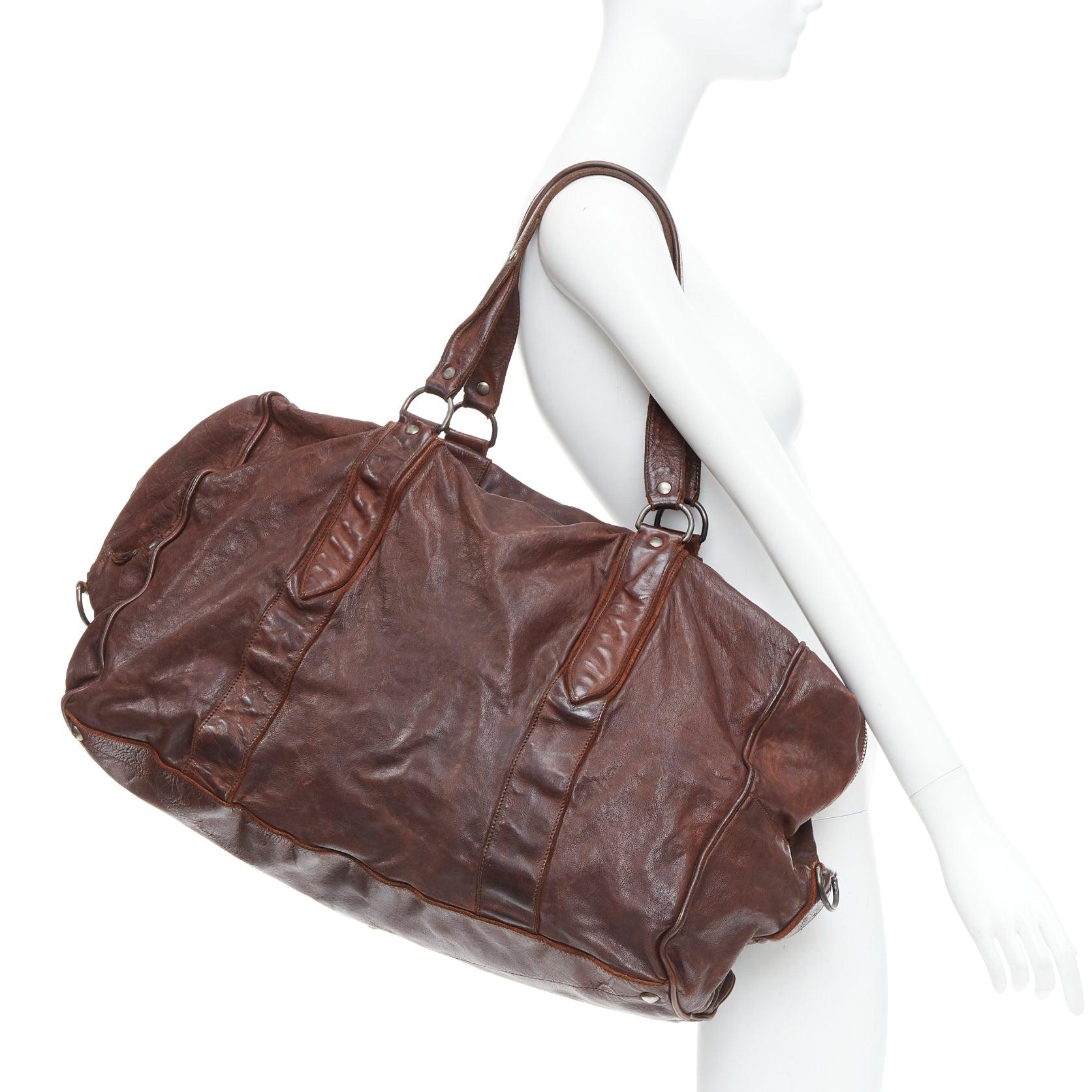 MIU MIU Vintage brown tumbled crinkled leather large travel bag
Reference: PRWU/A00179
Brand: Miu Miu
Designer: Miuccia Prada
Material: Leather
Color: Brown
Pattern: Solid
Closure: Zip
Lining: Brown Fabric
Made in: Italy

CONDITION:
Condition: Good,