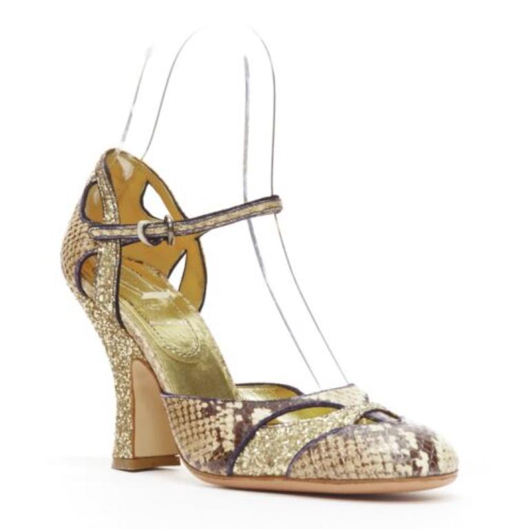 MIU MIU Vintage snake print gold course glitter chunky heel maryjane EU36.5
Reference: CELG/A00364
Brand: Miu Miu
Designer: Miuccia Prada
Material: Leather
Color: Brown, Gold
Pattern: Logomania
Closure: Ankle Strap
Lining: Gold Leather
Extra