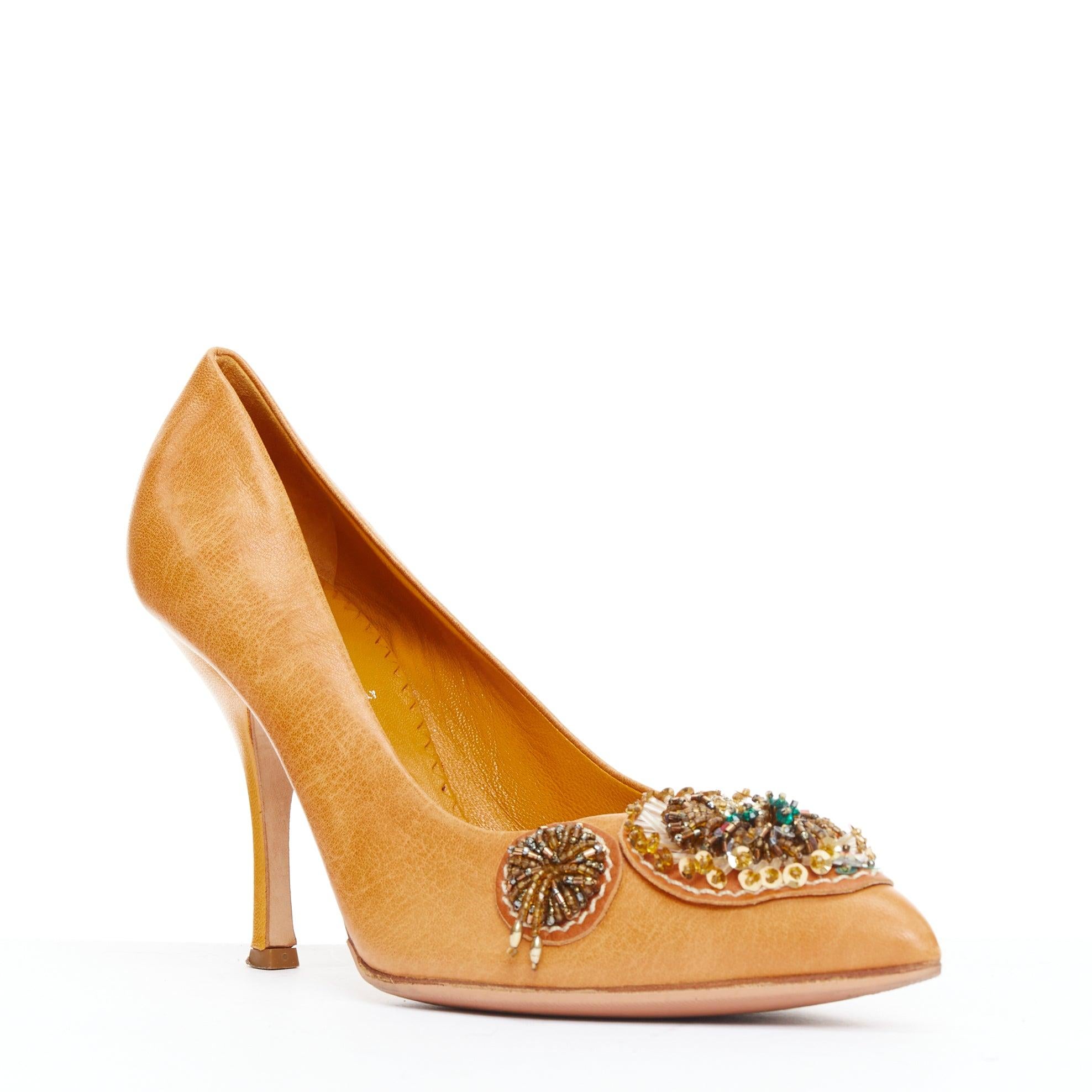 MIU MIU Vintage tan nude bead embellished kitten pumps EU36.5
Reference: ANWU/A01329
Brand: Miu Miu
Designer: Miuccia Prada
Material: Leather
Color: Brown, Multicolour
Pattern: Solid
Closure: Slip On
Lining: Orange Leather
Extra Details: Multicolor