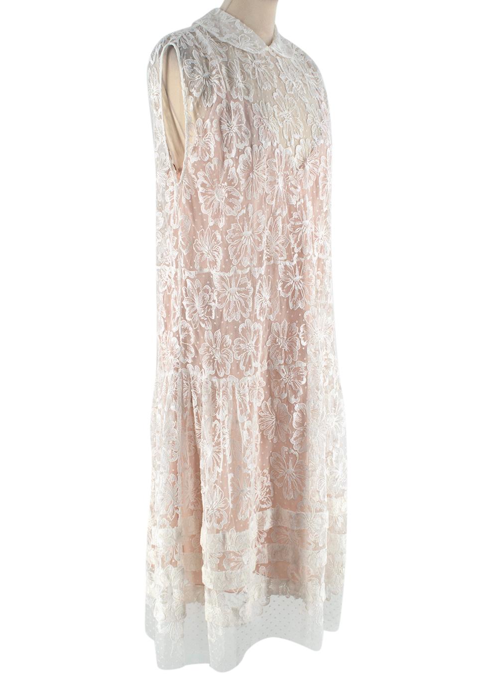Miu Miu White Floral Lace Sleeveless Dress

- Sleeveless lace midi dress
- Knee-length 
- Peter Pan collar
- Floral and polka dot lace patterns
- Button fastening at the nape of the neck
- Three stripes detail at the end 
- In-built light pink