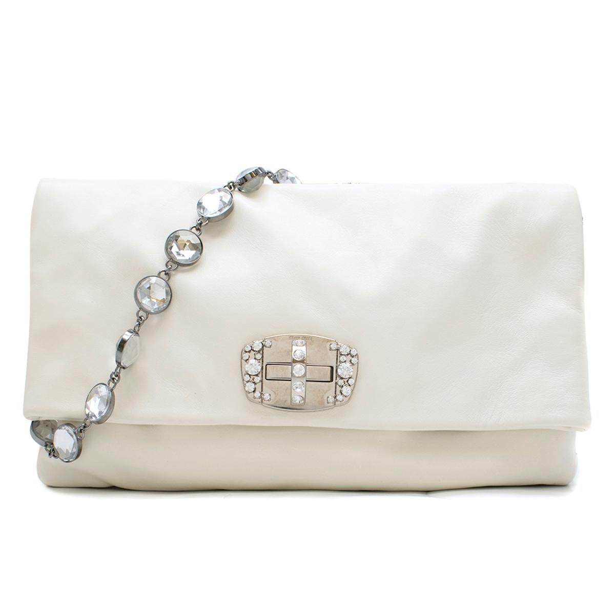 Miu Miu White Leather Crystal Foldover Shoulder Bag 

-Leather, white
-Crystal strap
-Crystal and sliver metal hardware closure on flap compartment
-Zip opening on main compartment 
-Black Interior lining
-