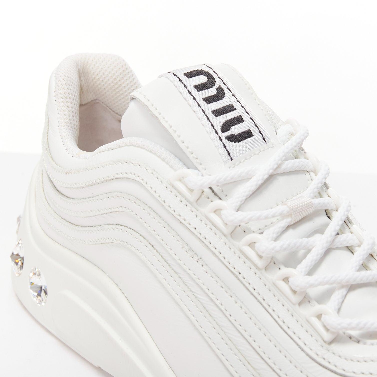 MIU MIU white leather logo tongue clear big crystal heels chunky sneakers EU38
Reference: AAWC/A01172
Brand: Miu Miu
Designer: Miuccia Prada
Material: Leather
Color: White, Black
Pattern: Crystals
Closure: Lace Up
Lining: White Leather
Extra