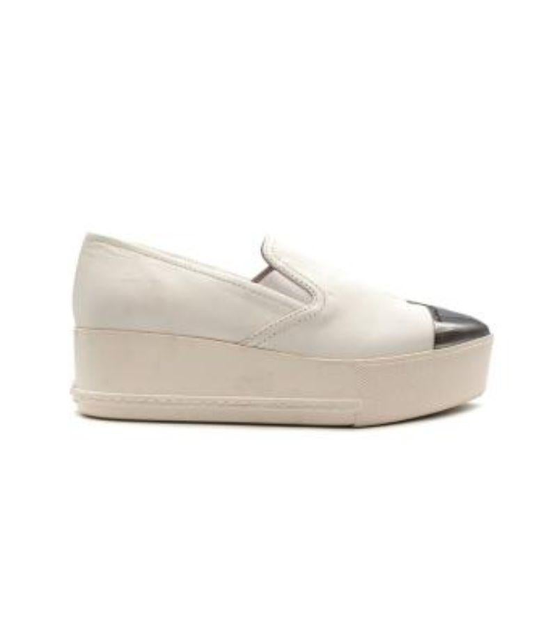 Miu Miu White Leather Platform Slip-On Pumps

- Pointed toes
- Metal cap toes
- Silver-toned hardware
- Leathered and branded insoles
- Branded cap toe and heels
- Solid platforms
- Slip-on

Material
Leather and rubber

Made in Italy

9.5/10