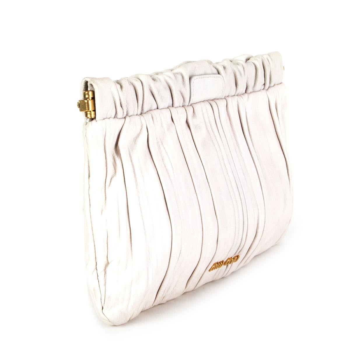 authentic Miu Miu pleated clutch in milk white calfskin featuring gold-tone hardware. Lined in off-white nylon with one open pocket against the front. Has been carried and is in excellent condition. 

Height 16cm (6.2in)
Width 25cm (9.8in)
