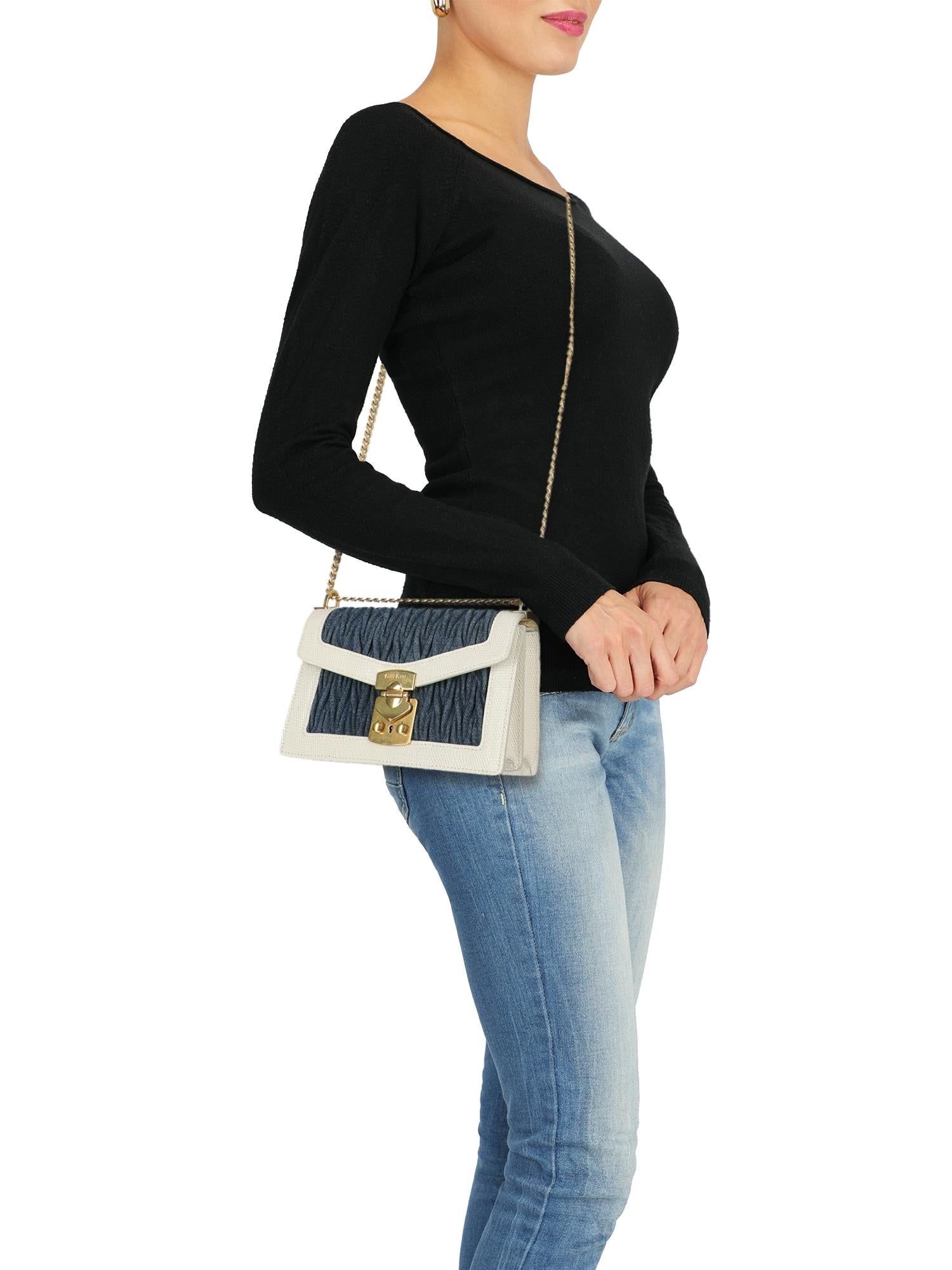 Cross body bag, leather, fabric, snake print, front logo, jeans, snap closure, gold-tone hardware, internal zipped pocket, internal pocket, multiple internal compartments, day bag

Includes:
- Dust bag 
- Product care 

Product Condition: