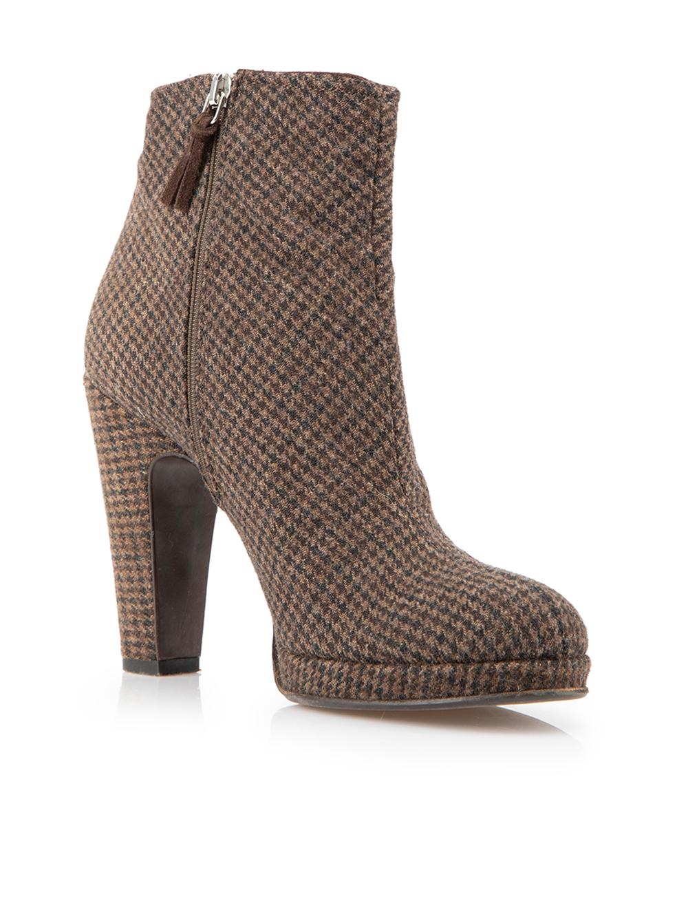 CONDITION is Very good. Minimal wear to boots is evident. Minimal wear to the heel tip and exterior tweed fabric on this used Miu Miu designer resale item. 
 
 Details
  Brown
 Tweed
 Ankle boots
 Houndstooth pattern
 Round toe
 High block heel
