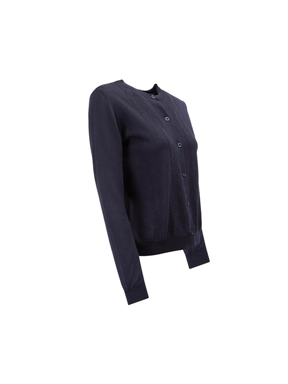 CONDITION is Very good. Minimal wear to cardigan is evident. Small hole visible aside fifth button on this used Miu Miu designer resale item.



Details


Navy

Wool

Long sleeve

Knit cardigan

Form fitting

Round neck

Front button