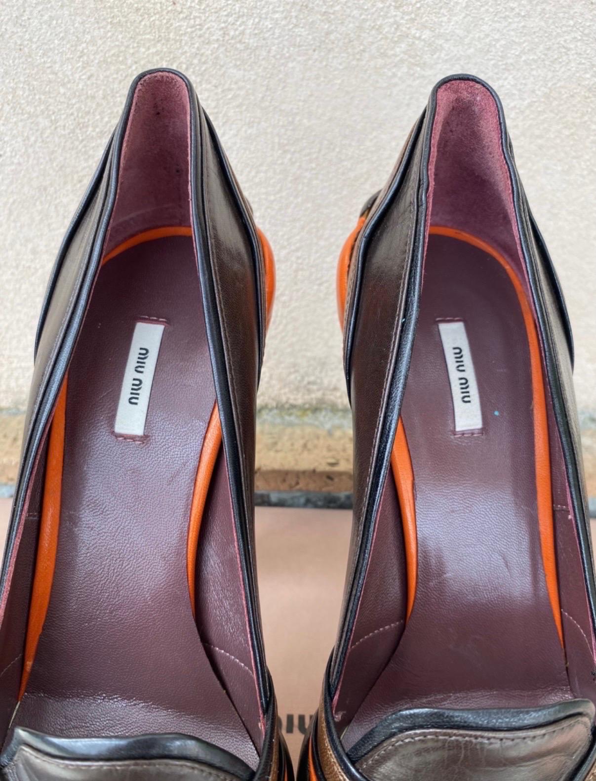 Miu Miu platform heel. 
Collection Fall 2008 RTW.
Featuring two different brown shades and orange details. Size 39. dimensions: heel 14 cm, insole 25 cm, some signs of wear as shown in the photos but good condition overall. They come with original
