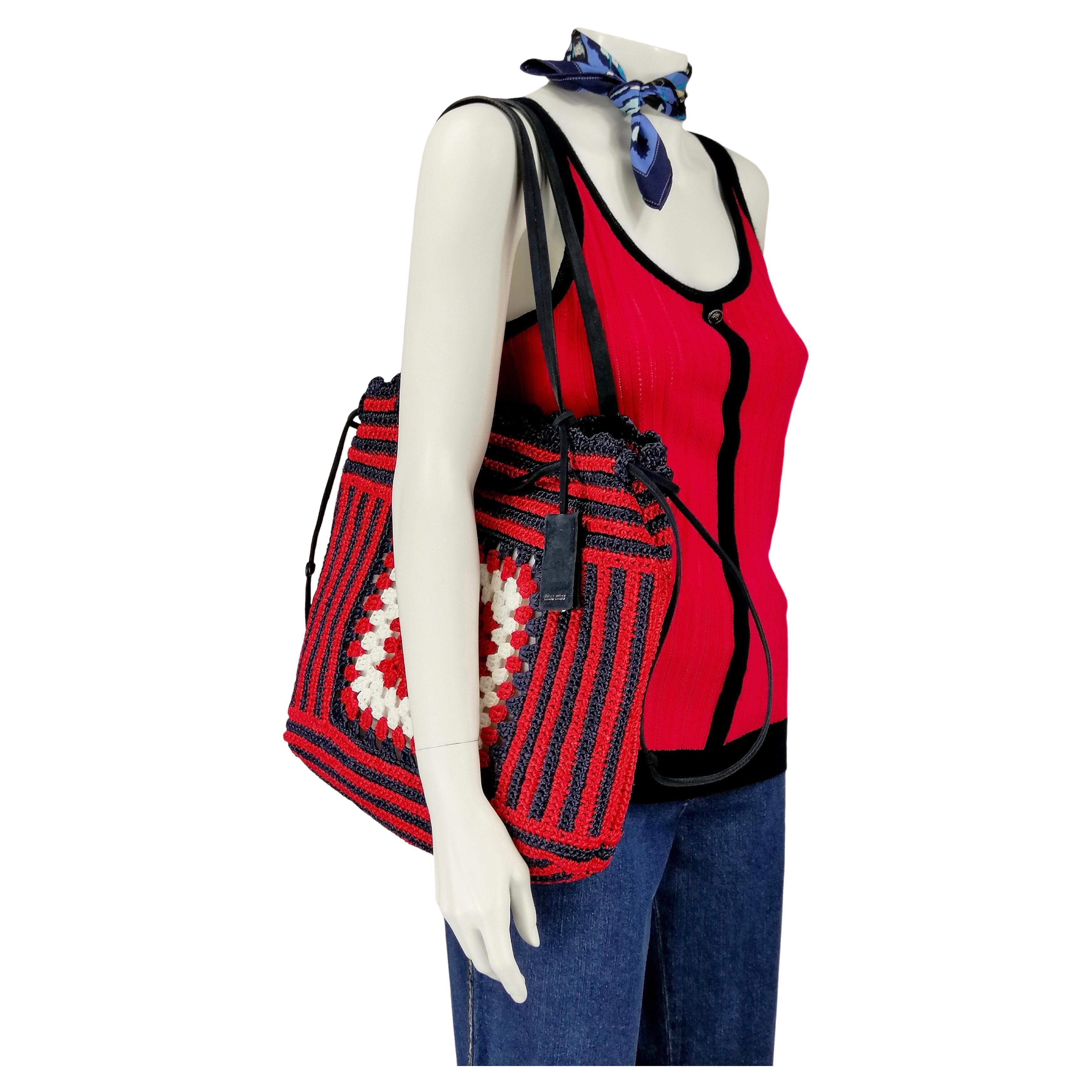 MIUMIU shoulder bag
 rafia crochet red, navy, white
Details navy suede
Measures:
Width cm. 35
Hight cm. 32
Depth cm. 10
Shoulders cm. 26
Very good condition
