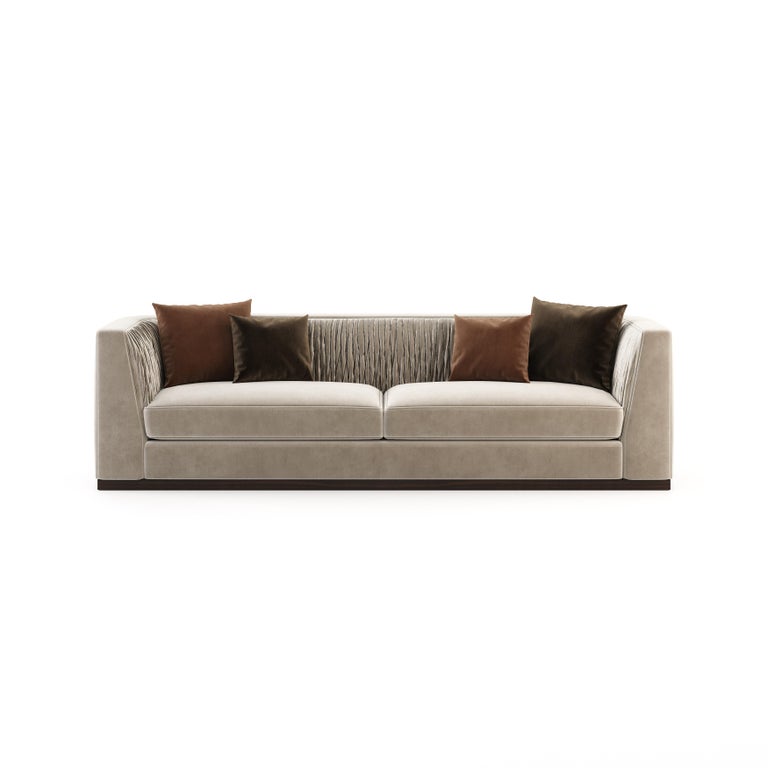 Miuzza sofa brings comfort, happiness and glamour to your living room. This contemporary coach fully upholstered in exquisite velvet fabric is the new focal point of interior design projects. Inspired by the Art Deco silhouettes, this sofa is