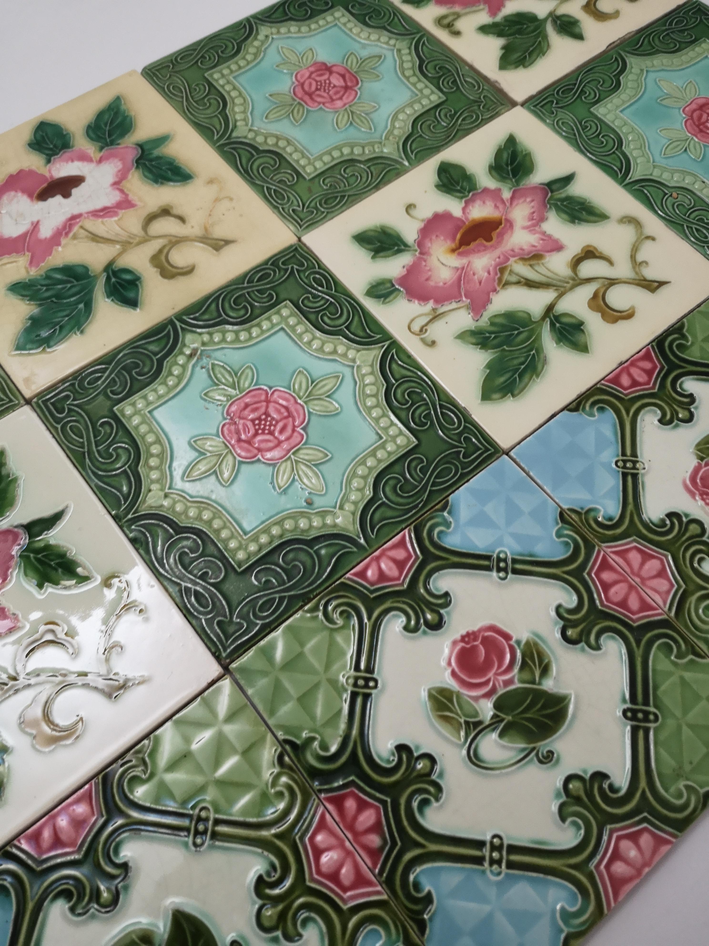 This is an amazing set of mixed antique Jugenstil/Art Nouveau handmade tiles, manfuctactured by S.A. Produits Ceramiques de la Dyle, circa 1930.

 A beautiful relief and deep rich warm green, turquoise, soft yellow and rose color. These tiles would