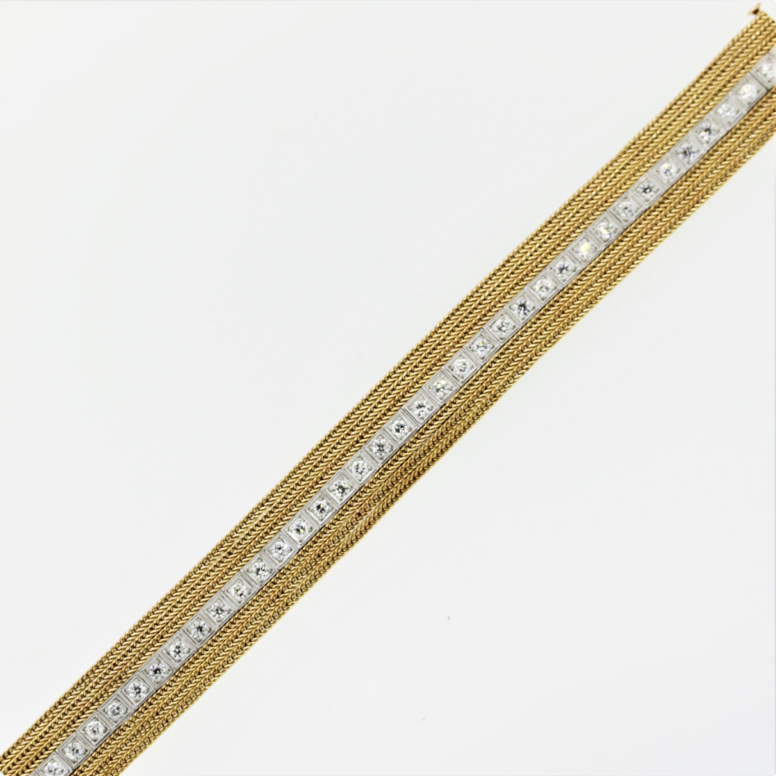 An original antique platinum diamond line bracelet that has been modified years later with braided gold additions. The bracelet features 2.75 carats of European-cut diamonds set in platinum (antique portion) and rows of braided 14k yellow gold on