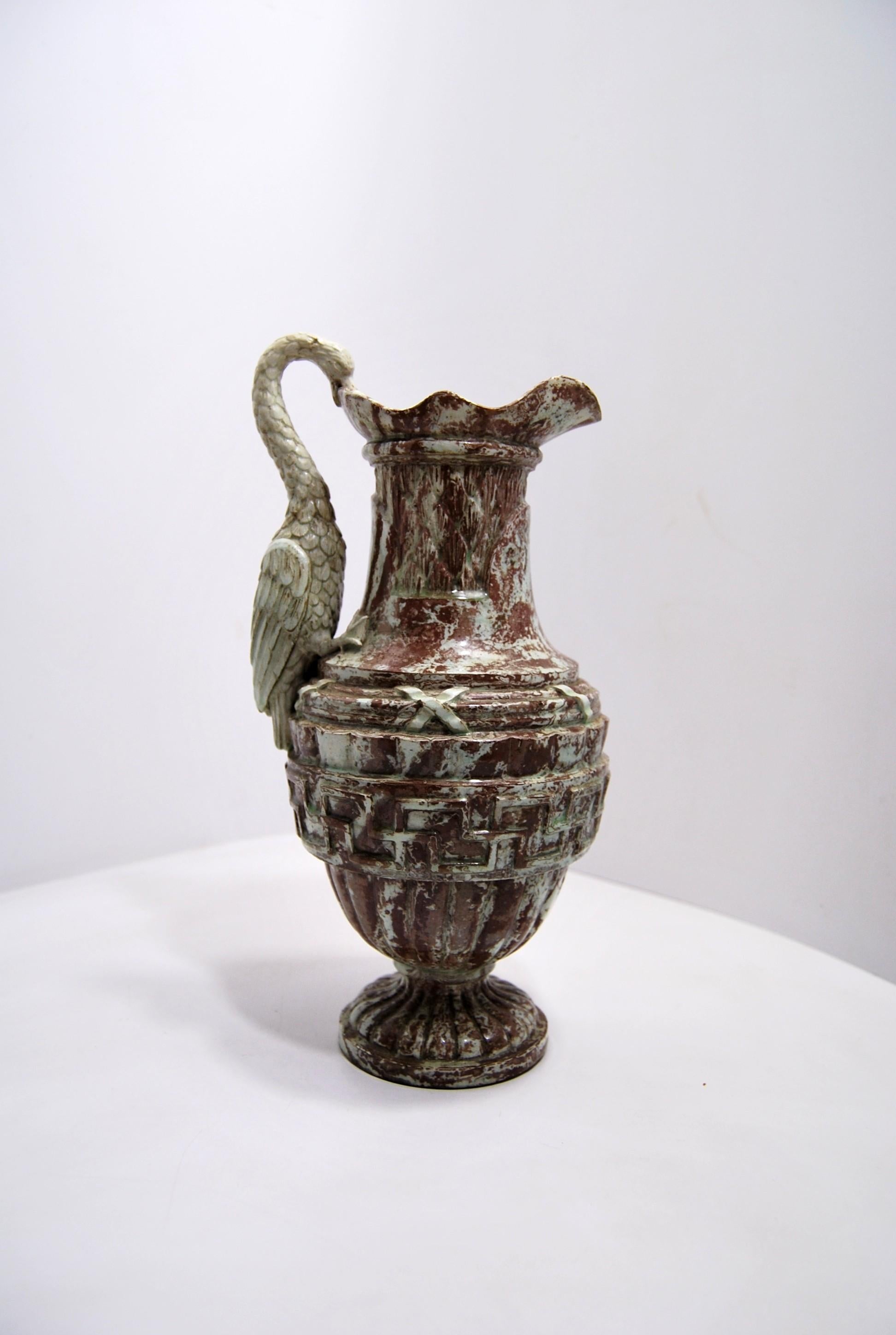 Rarely ewer in mixed clay from the Orleans factory of Grammont Ainé(1764-1832)
End of the 18th century, around 1790
Very beautiful & rare zoomorphic ewer in earthenware mixed with the appearance of marble covered with translucent enamel with green
