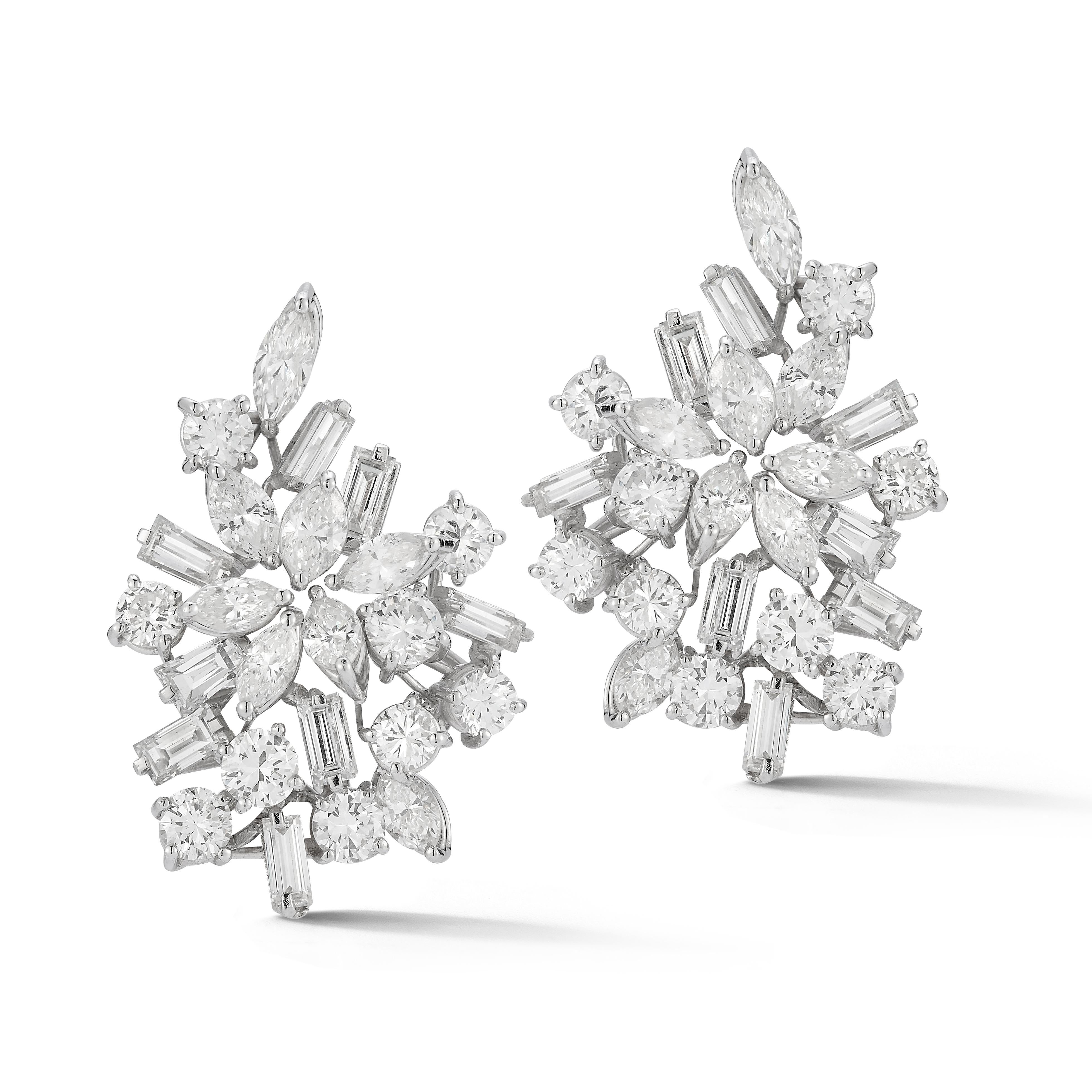 Mixed Cut Diamond Earrings

A pair of platinum earrings set with 66 baguette cut diamonds, 18 round cut diamonds, and 16 marquise cut diamonds

Total Approximate Diamond Weight: 7.14 carats

Length: 1.25