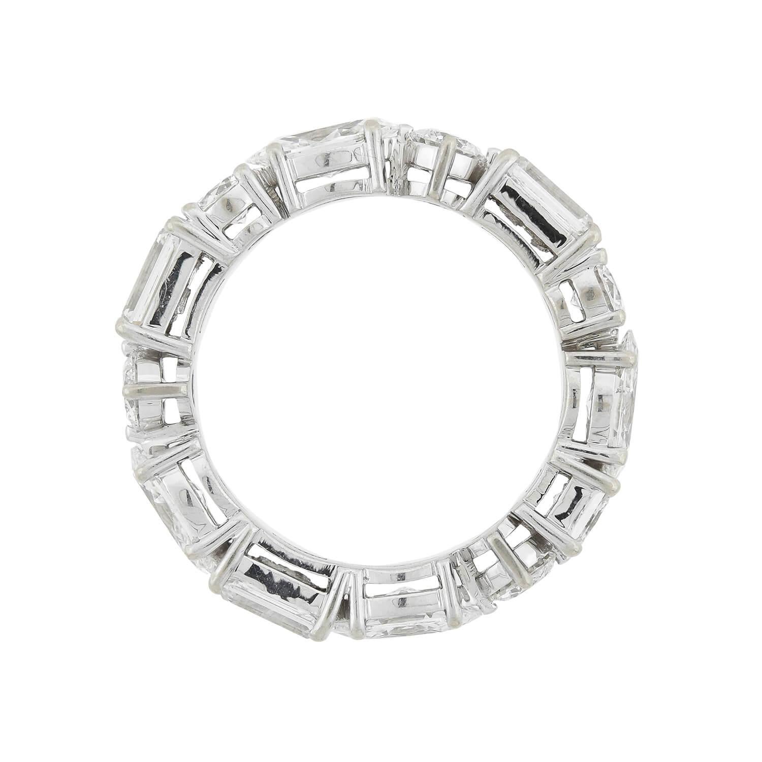 A gorgeous contemporary eternity band! Crafted in 14kt white gold, this ring features 3.75ctw of sparkling diamonds! Five Round, four Marquis, three Baguette, and a single Princess Cut diamond create a unique look as they encircle the band in their