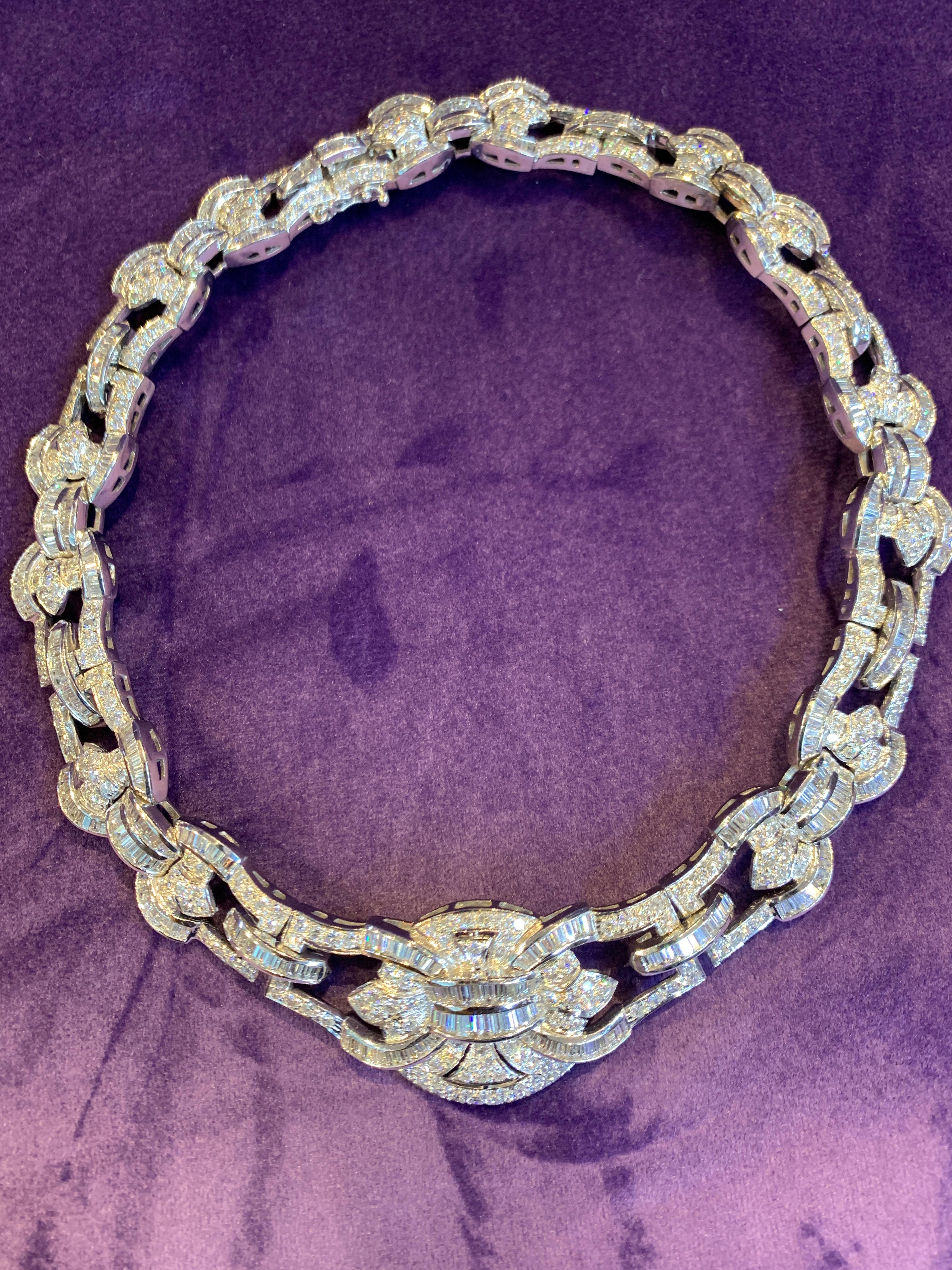 Diamond & Gold Center Plaque Necklace, 18K White Gold openwork necklace with center plaque. Consisting of 499 Baguette Diamonds, approximately 22.95 carats & 301 round cut diamonds approximately 15.05 carats.
14 inches in diameter

