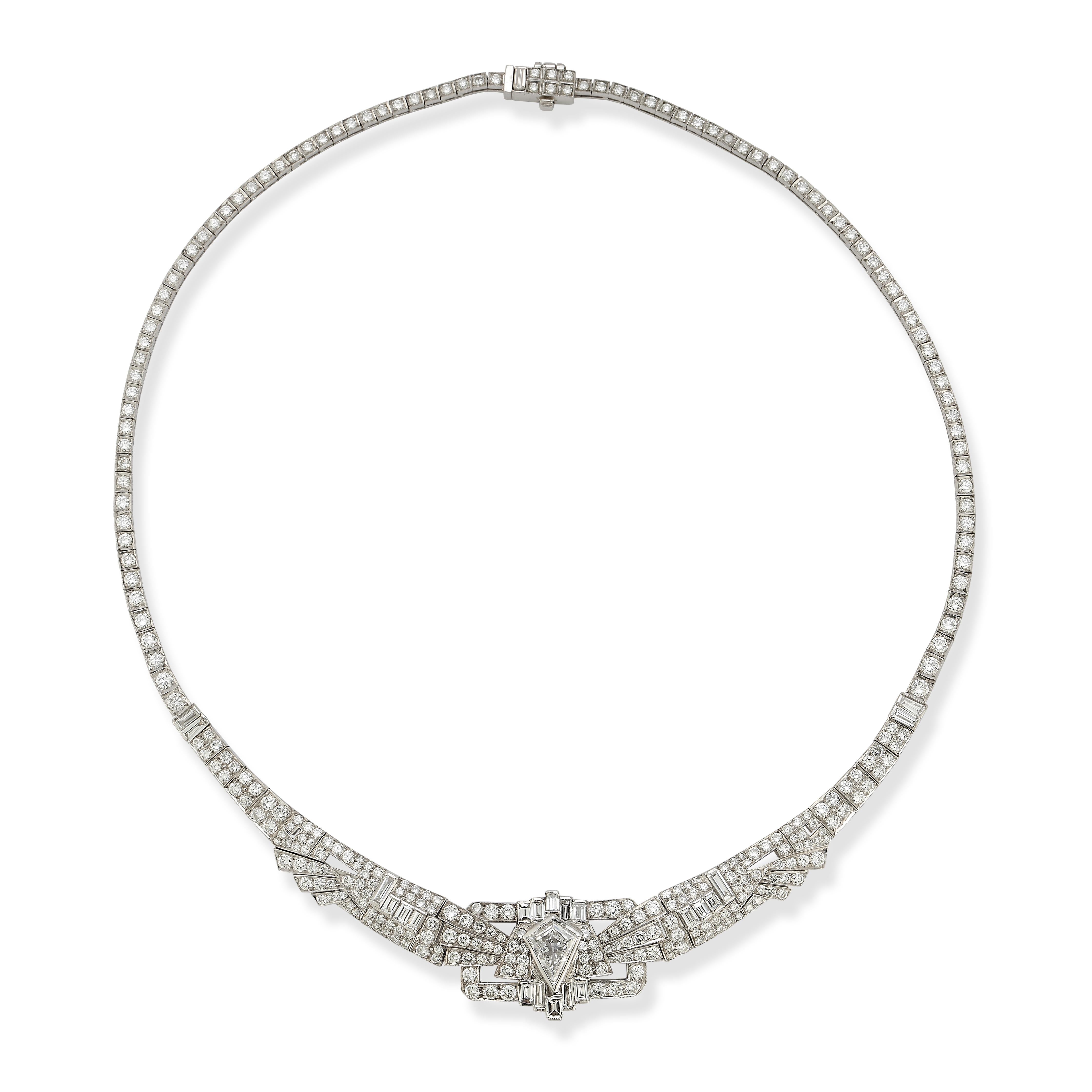 Mixed Cut Diamond Necklace

An 18-karat white gold necklace set with 308 round cut diamonds, 22 baguette cut diamonds, and 1 approximately 1.60 carat kite shaped diamond

Total Approximate Diamond Weight: 10.36 carats

Length: 15