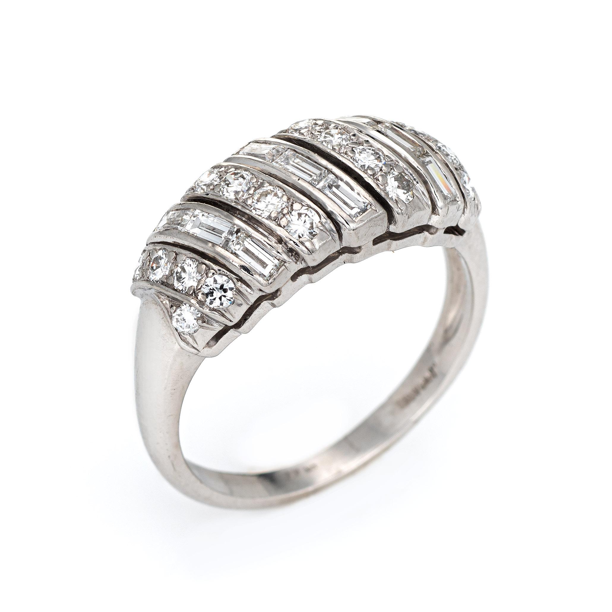 Stylish mixed cut diamond ring (circa 1950s to 1960s) crafted in 900 platinum. 

Straight baguette & round brilliant cut diamonds total an estimated 0.90 carats (estimated at H-I color and VS2-SI1 clarity). 

The elegant mid century band is set with
