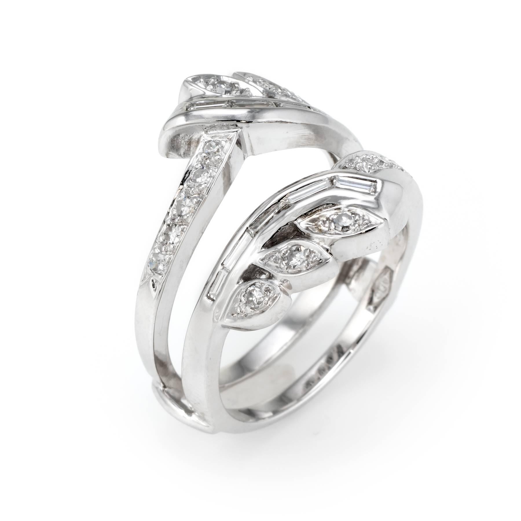 Elegant vintage wedding ring guard (circa 1950s to 1960s), crafted in 14 karat white gold. 

Mixed cut diamonds (straight baguette and single cut) total an estimated 0.60 carats (estimated at G-H color and VS2-SI1 clarity).   

The ring is in