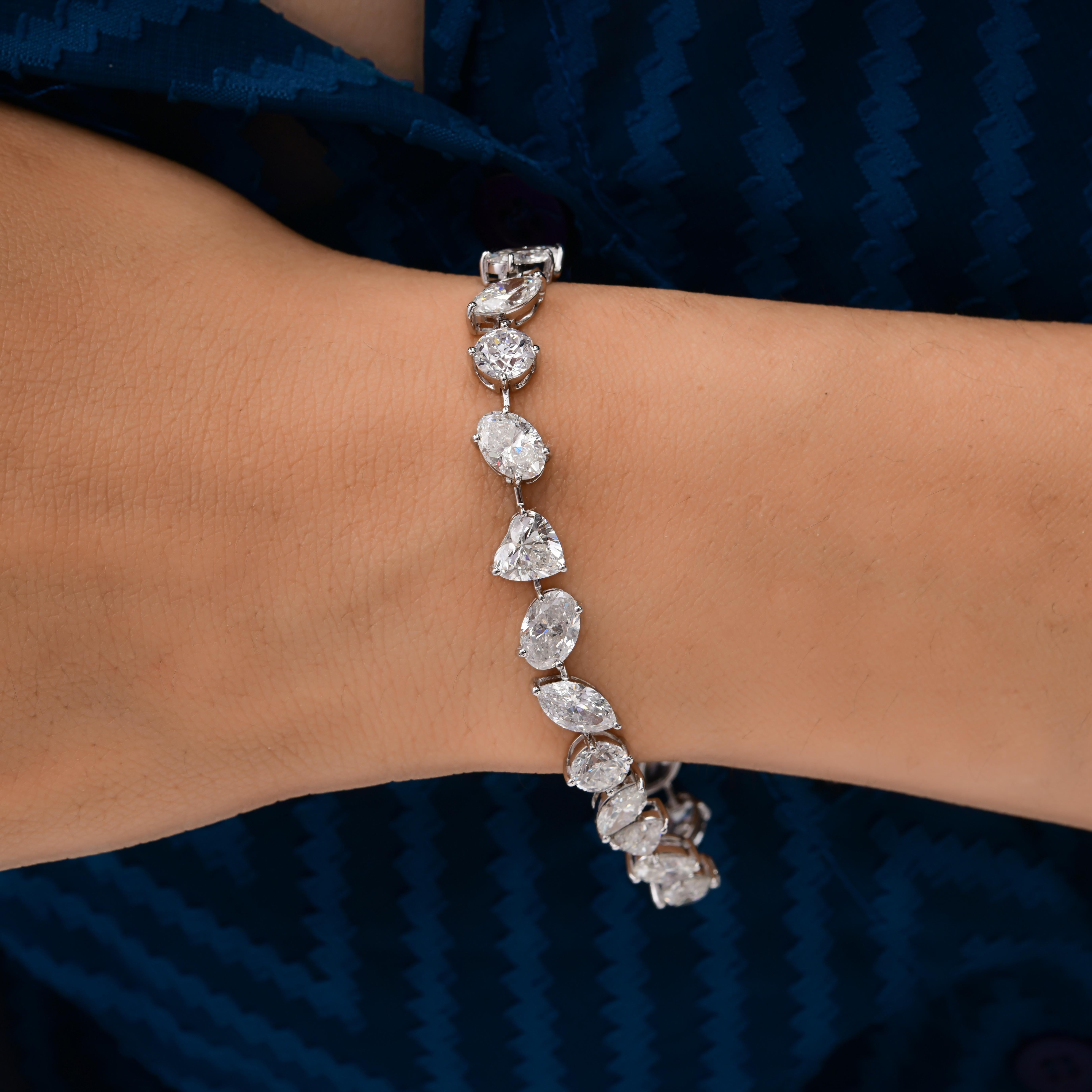 Gemischter Schliff SI/H 18,43 Karat Naturdiamant 18 Karat Weißgold Tennisarmband 
Dieses exquisite Diamantarmband präsentiert eine harmonische Mischung aus Diamanten im Marquise-, Rund-, Birnen- und Prinzessinnenschliff, gefasst in luxuriösem
