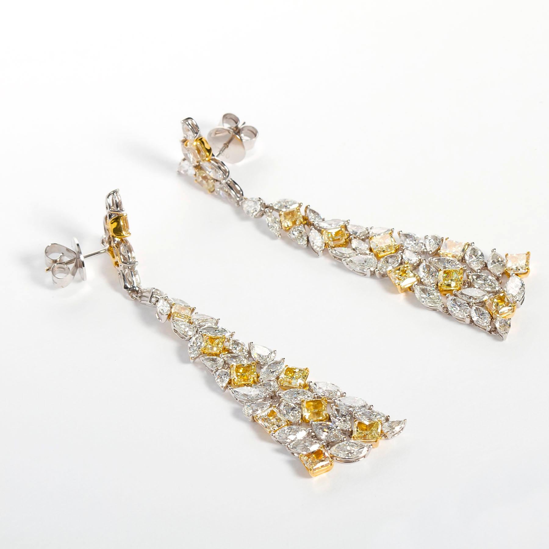 The 18-karat yellow and white gold Mixed Cut White & Yellow Diamond Pyramid Earrings totaling 20.04 carats of diamonds are an exquisite example of fine jewelry craftsmanship, blending luxurious materials with an innovative design. These earrings
