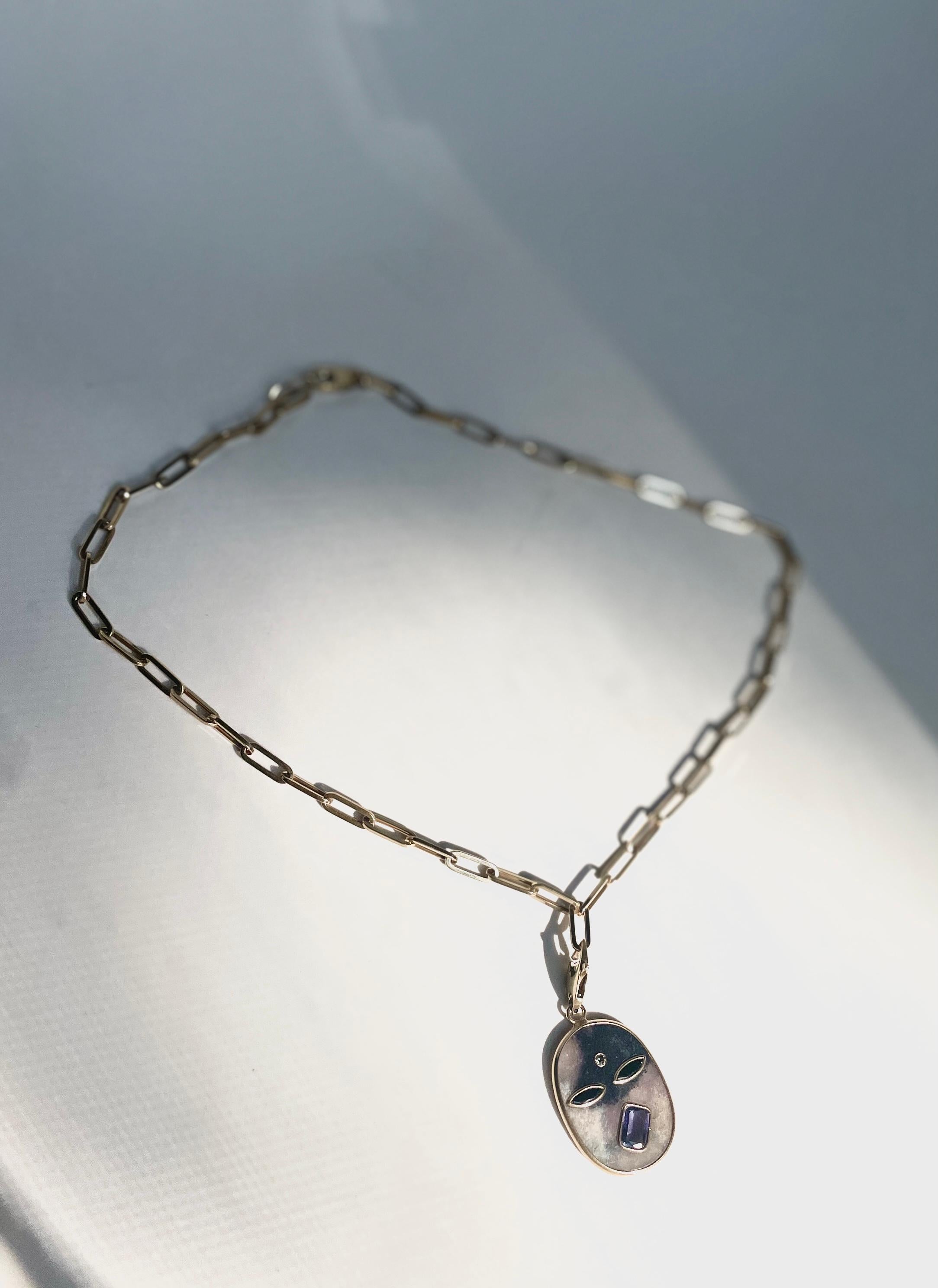 Deep Seer Amulet Necklace by L'ENCHANTEUR.

Polished Rough Parable, Green Tourmaline, Tanzanite, Diamond, 14K Yellow Gold.

The Deep Seer is a unique, charm inspired by The All that comes with many faces to express and experience life happening. One