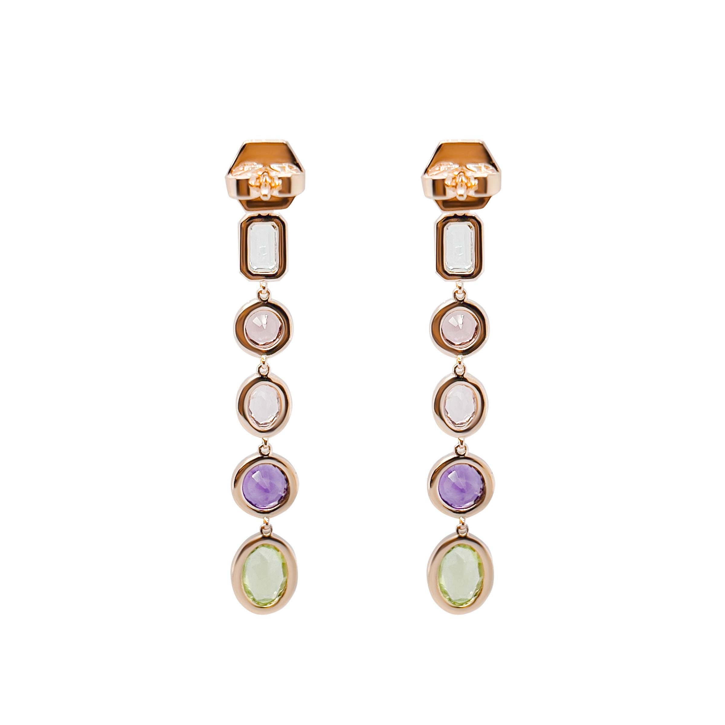 This stunning pair of 18k rose gold earrings feature a eye catching array of gemstones. Each earring is crafted with the precise balance of natural spinel, peridot, amethyst, and aquamarine. In addition, pave set diamonds are delicately surround the