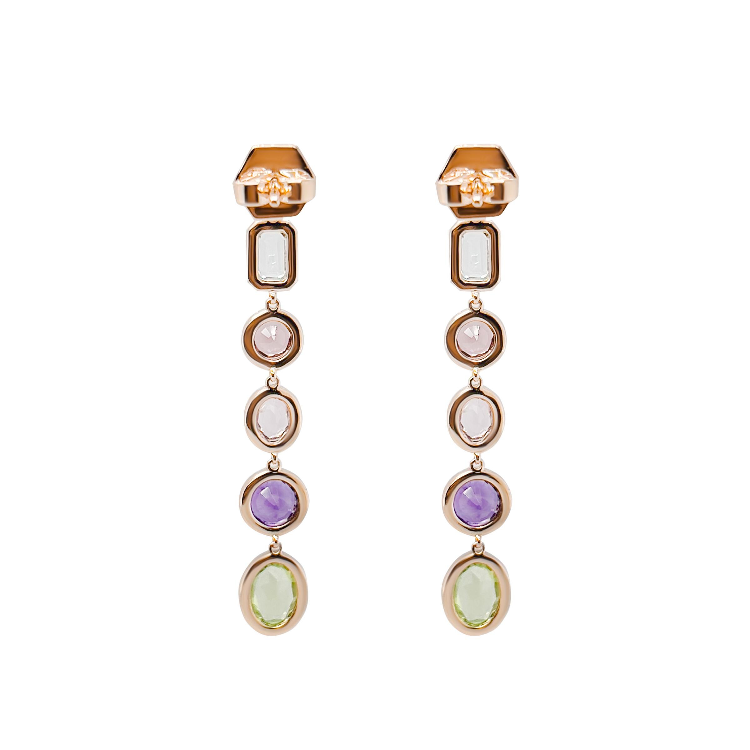 This stunning pair of 18k rose gold earrings feature a eye catching array of gemstones. Each earring is crafted with the precise balance of natural spinel, peridot, amethyst, and aquamarine. In addition, pave set diamonds are delicately surround the