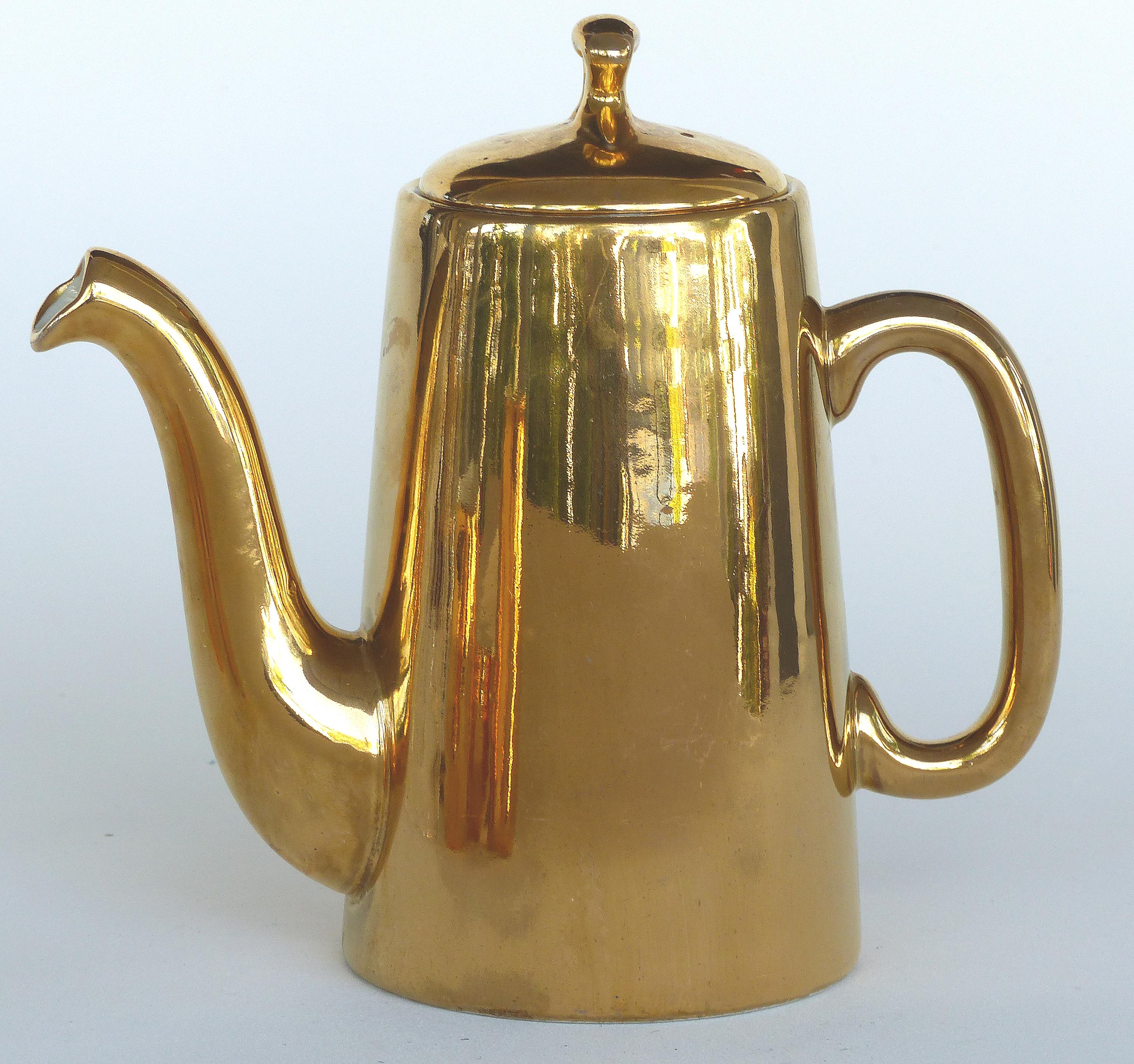 Mixed Gold Luster Coffee Set from Pillivuyt of France and Royal Worchester

Offered for sale is a mixed four piece gold luster-ware set including a coffee pot by Pillivuyt of France and three accompanying Royal Worchester pitchers and sugar bowl.