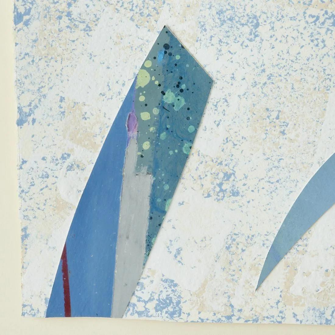 A mixed media collage in blues, framed and signed by Edward Meneeley, 1983. The contemporary artwork mixes paper and paint in varied shades of blue with an open curved and angular abstract design. The artwork is signed, matted and sits in a gold