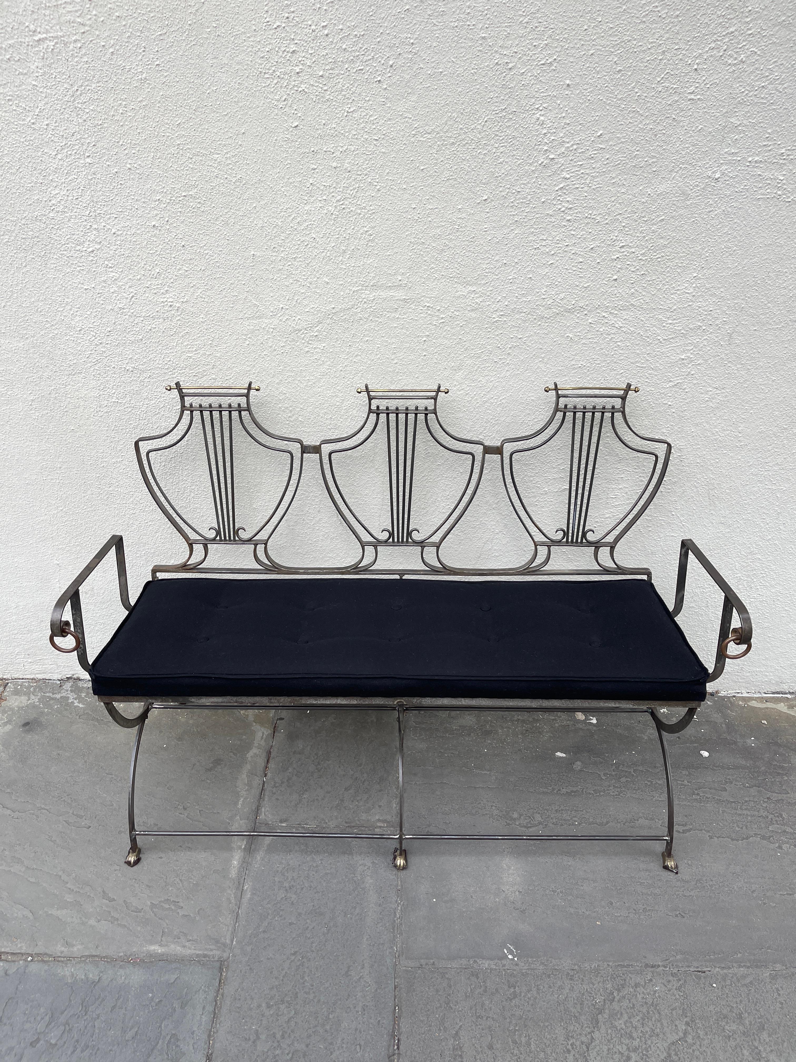 Mixed metal architectural formed bench with tufted cashmere seat bottom.