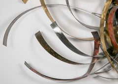 Mixed Metal Wall Sculpture Titled "Saturn's Rings" by Silas Seandel