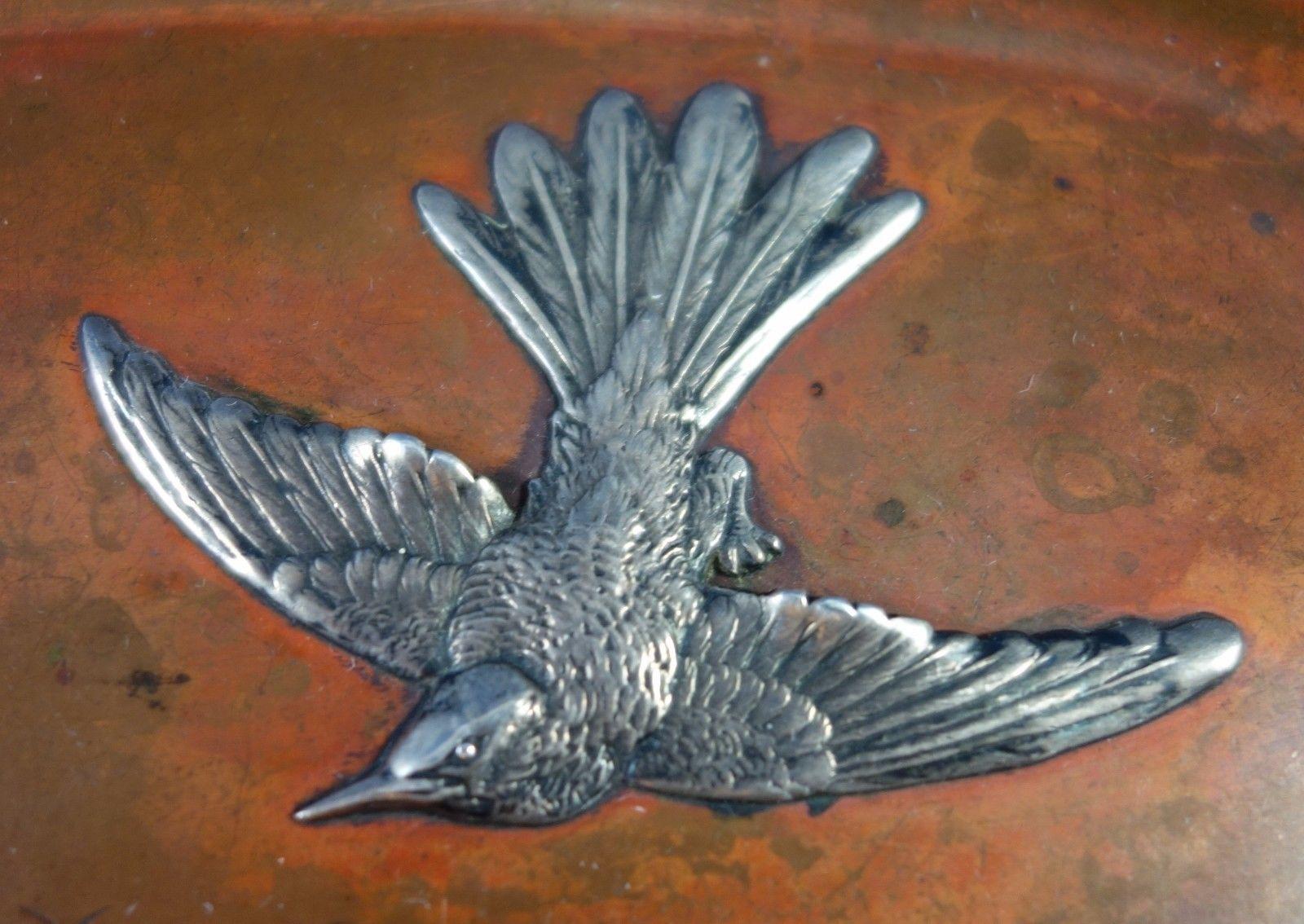 Mixed metals by Gorham 

Fabulous mixed metals by Gorham tray made with copper and silver. The tray has an applied silver bird, butterfly, and floral scene with grains of sand and small calf. The background is etched with mountains and grasses. The