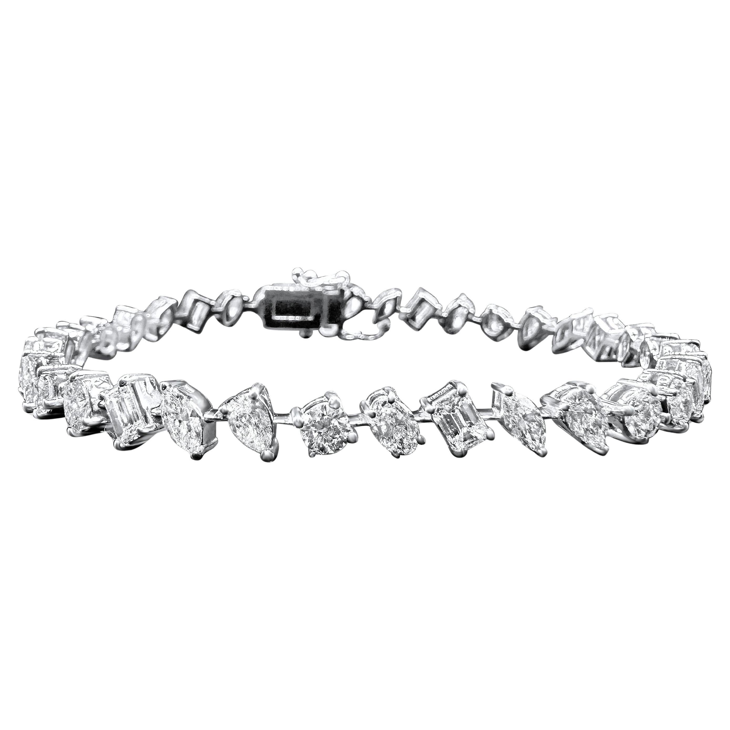This sophisticated tennis bracelet presents a captivating mix of emerald-cut and round brilliant diamonds, expertly arranged in an alternating pattern. Crafted in 14K white gold, the bracelet features a total diamond weight of approximately 6.75