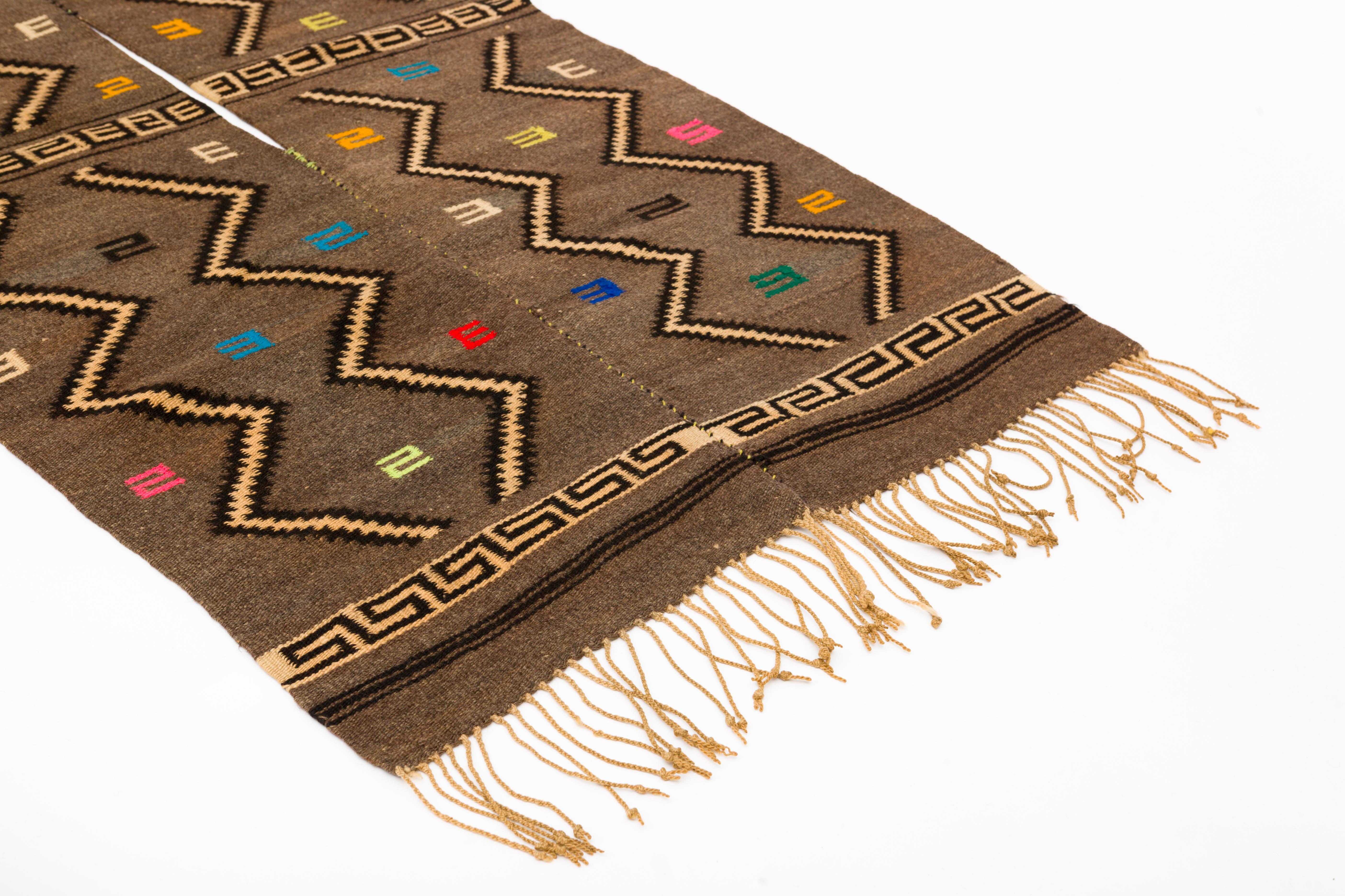Mixtec wool serape blanket, handwoven with traditional cloud and thunder symbols. Slit opening in middle for wearing. Hand knotted fringe. 
Oaxaca, Mexico, c. 1950's