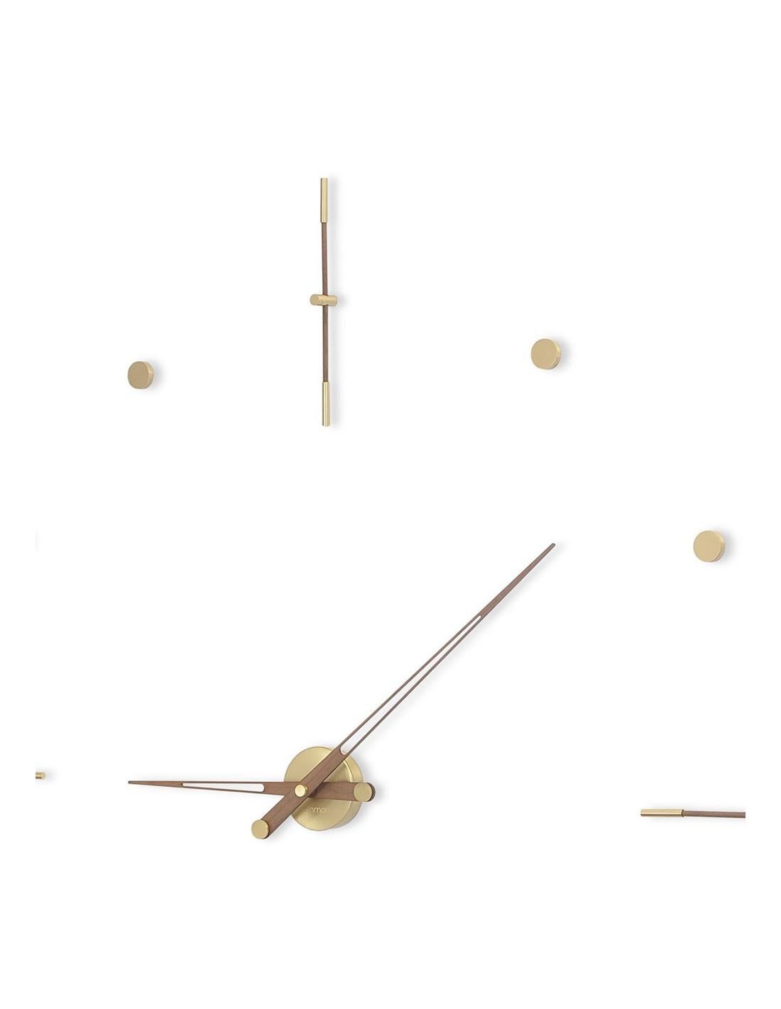 Mixto Gold N wall clock has an elegant and dynamic design , combining fine wood and chrome steel materials.
Mixto N wall clock : Polished brass and walnut, hands in walnut.
 Polished brass and wenge finish, hands in wenge finish.
Available in 2