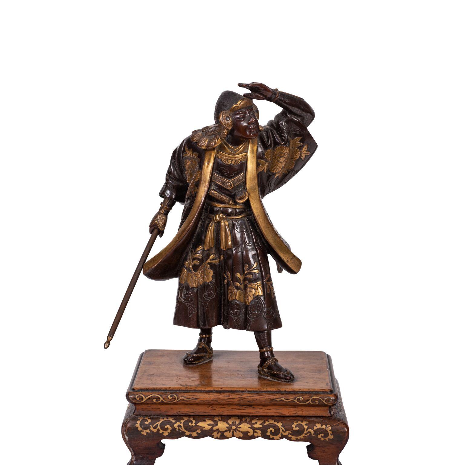 Miyao patinated bronze model of a Samurai
Meiji Period (1868-1912),
signed Miayo.
The figure wearing decorated robes, standing with one hand raised looking into the distance, the other hand clasping a spear.
Mounted on a rectangular lacquered