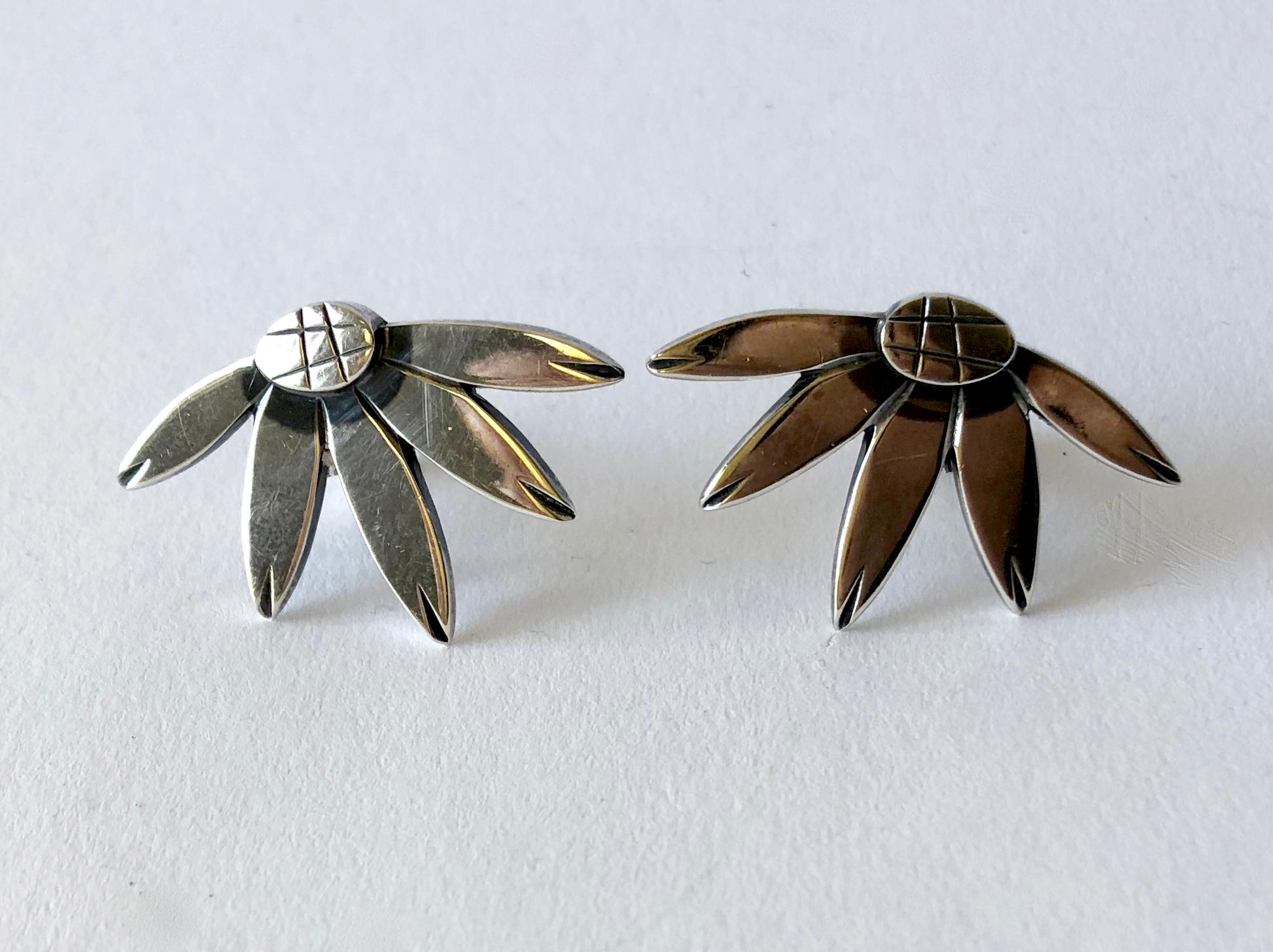 1950s modernist sterling silver clip on earrings created by Janiye Matsukata for Atelier Janiye, Boston Massachusetts.  Earrings measure 1 3/8