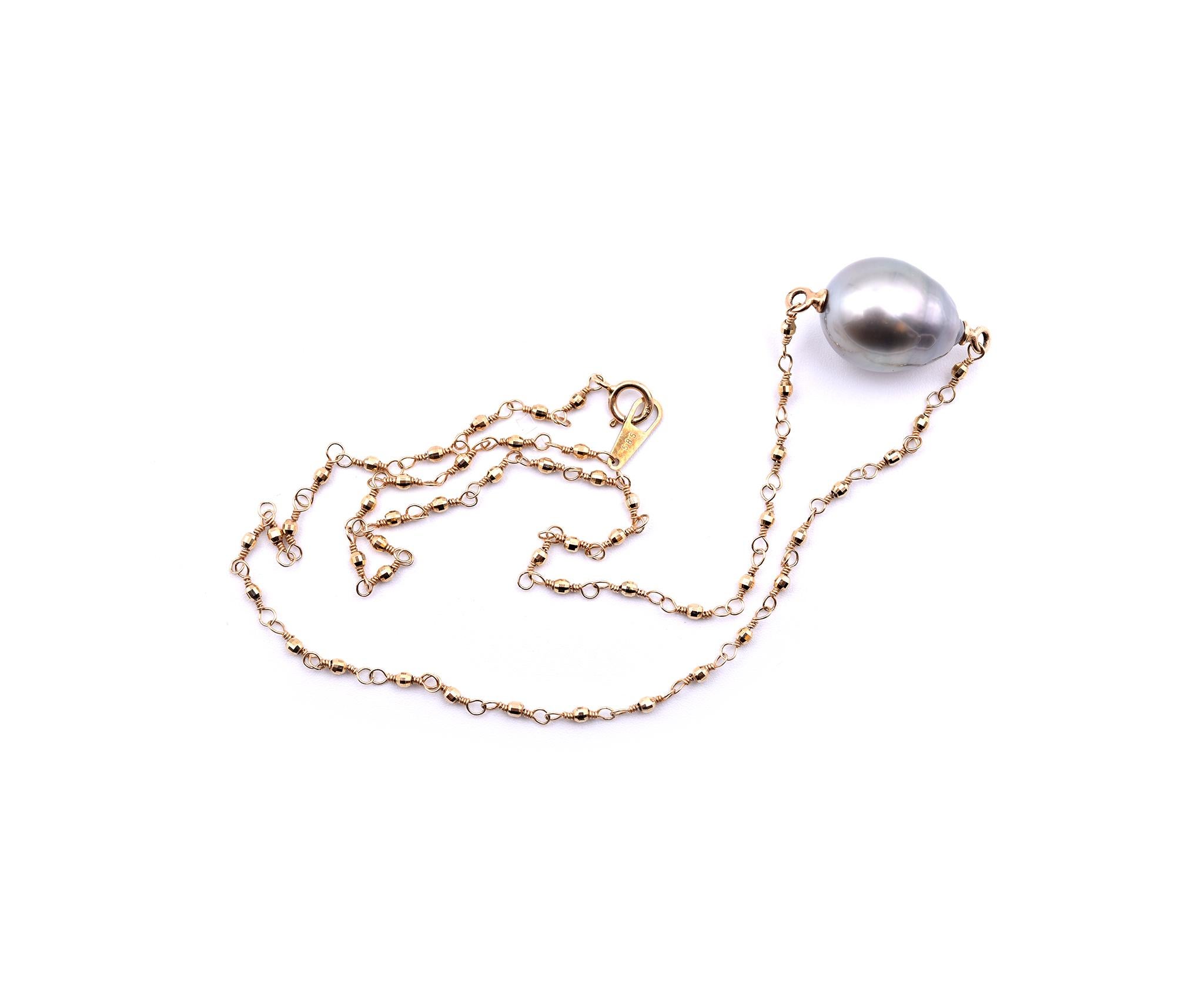 Concepteur : Mizuki
Matériau : or jaune 14k 
Perle de Tahiti : 1 perle de Tahiti baroque 12.20mm par 15.45mm
Dimensions : Le collier mesure 14 pouces de long 
Poids : 5,34 grammes
