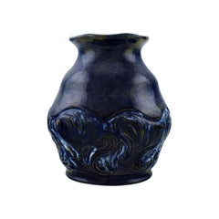 Møller & Bøgely. Beautiful ceramic vase in dark blue glazed ceramics. Ca. 1920