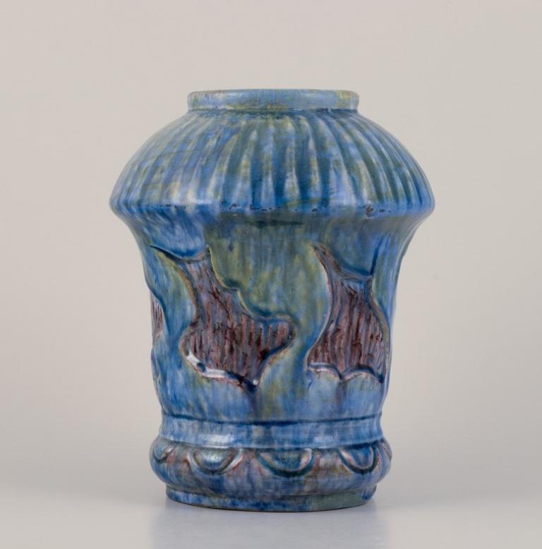 Møller & Bøgely, Denmark. 
Danish Art Nouveau ceramic vase in the style of Bindesbøll. 
Glaze in blue and green tones.
Approximately 1918.
Marked.
Perfect condition.
Dimensions: Height 21.5 cm x Diameter 16.0 cm.