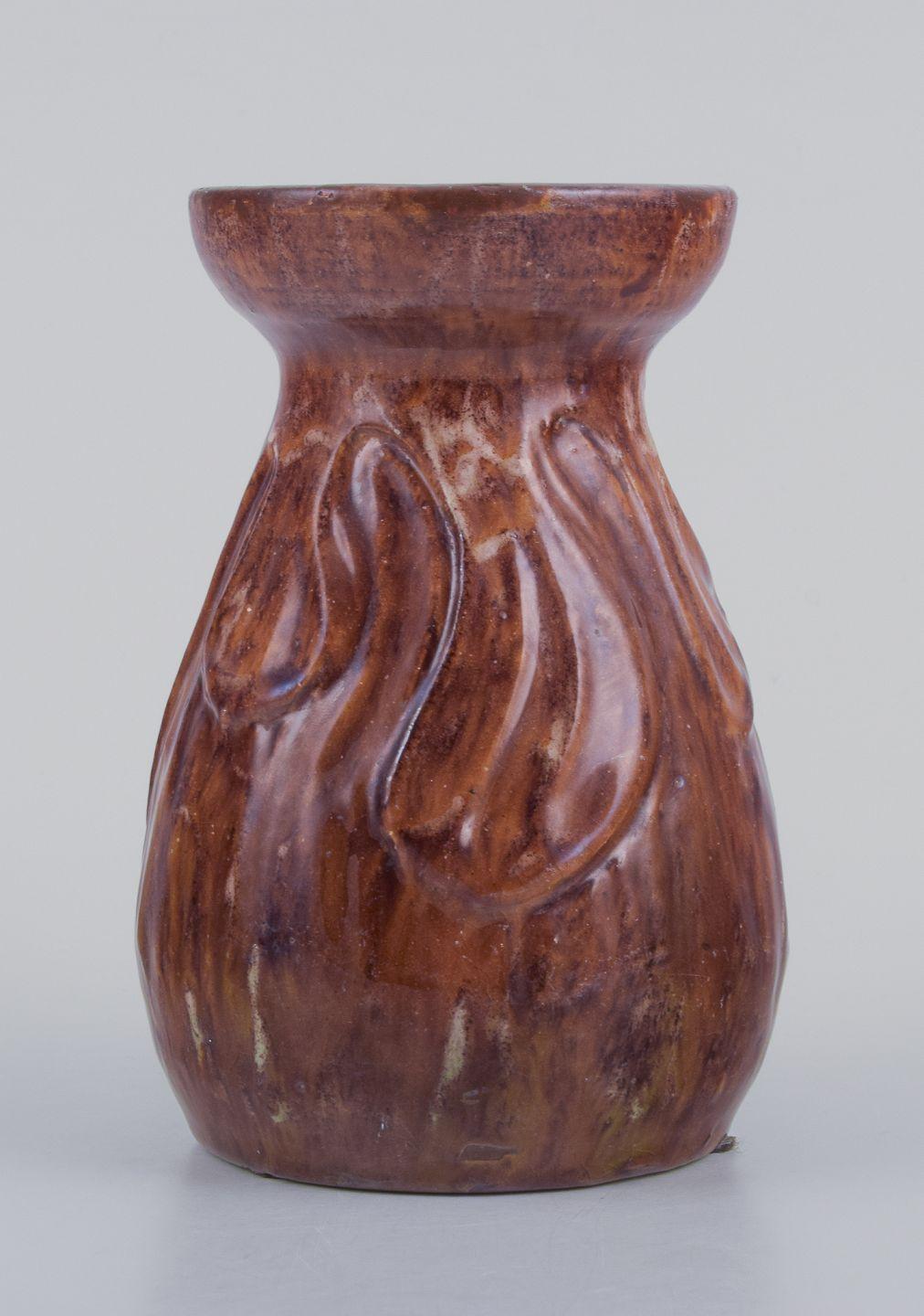PRE-OWNED GOODS ARE EXEMPT FROM IMPORT TARIFFS FOR U.S., UK, AUSTRALIAN & CANADIAN CUSTOMERS.   
THEREFORE, NO IMPORT TARIFFS WILL BE APPLICABLE TO YOUR PURCHASE. 

Møller & Bøgely. Unique Art Nouveau vase in glazed ceramic. 
Leaves in relief.
Glaze