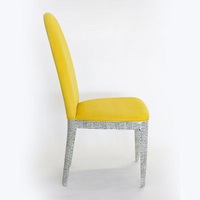 This fantastic dining chair has a wooden structure covered with black and white patterned wallpaper, applied by handwork and protected by high gloss finish. The seat and back cushions are upholstered with a washable yellow fabric, similar to nabuk.