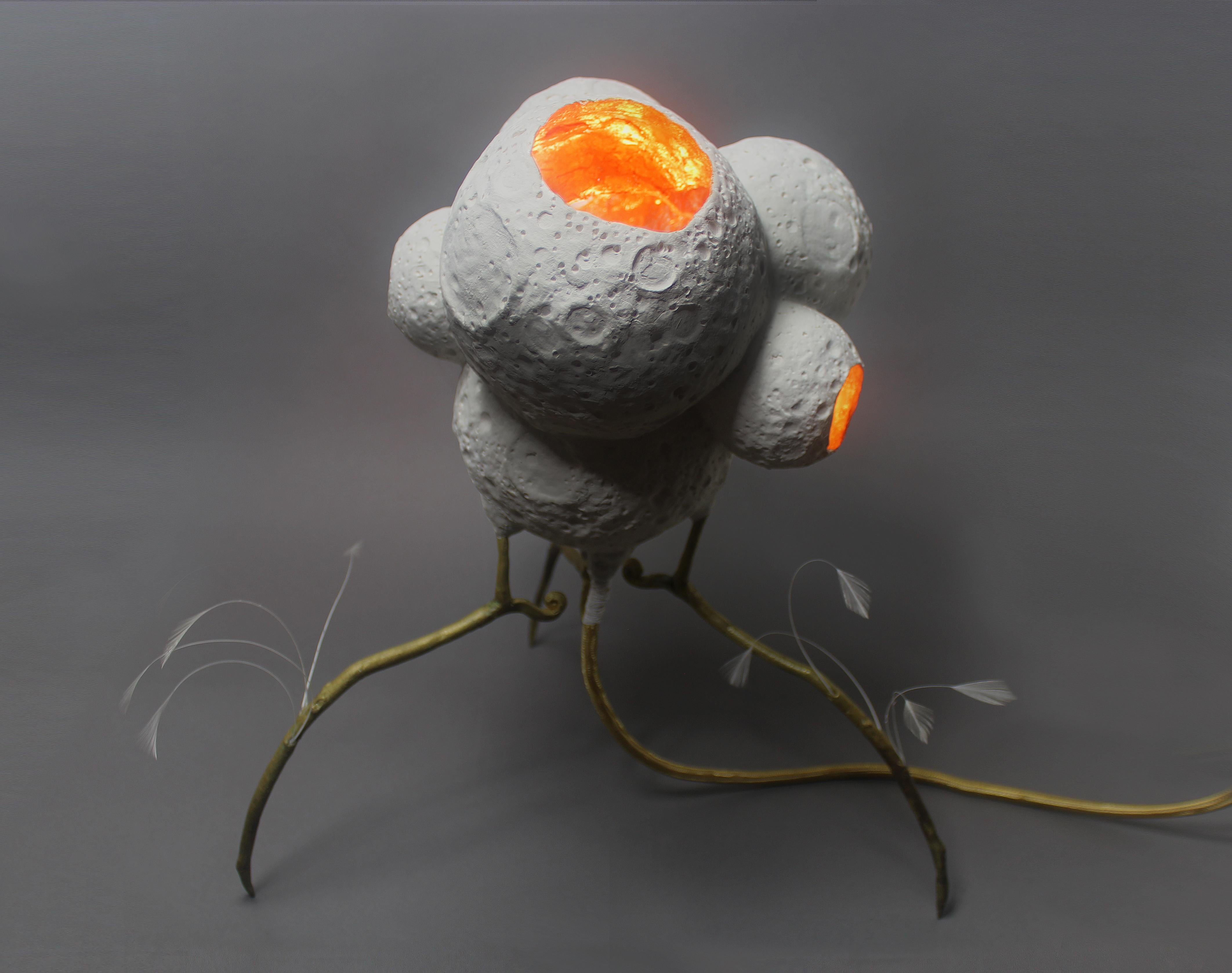 This illuminated sculpture by Mikel Durlam and Monty J is a collaborative piece from their collection that began with their 2017 two-person show at Greenpoint Hill.

The slip-cast ceramic moons and cast brass legs are made from originals