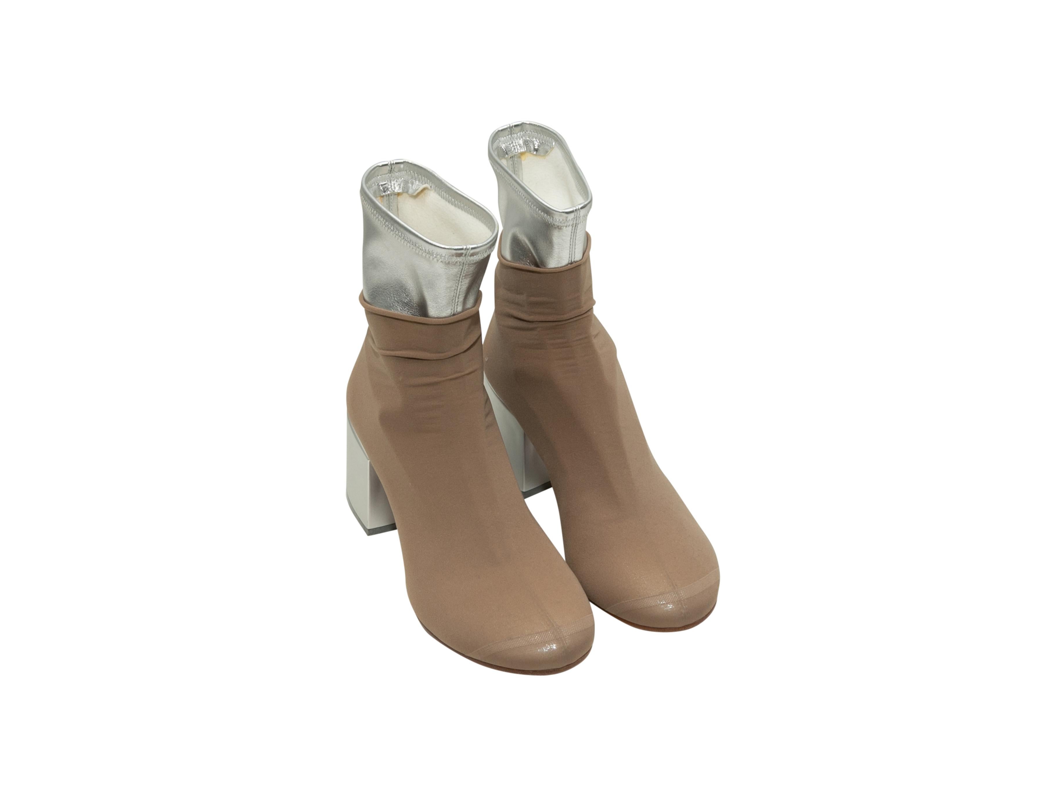 Product details: Beige and metallic silver leather sock ankle boots by MM6 Maison Margiela. Block heels. 2.75