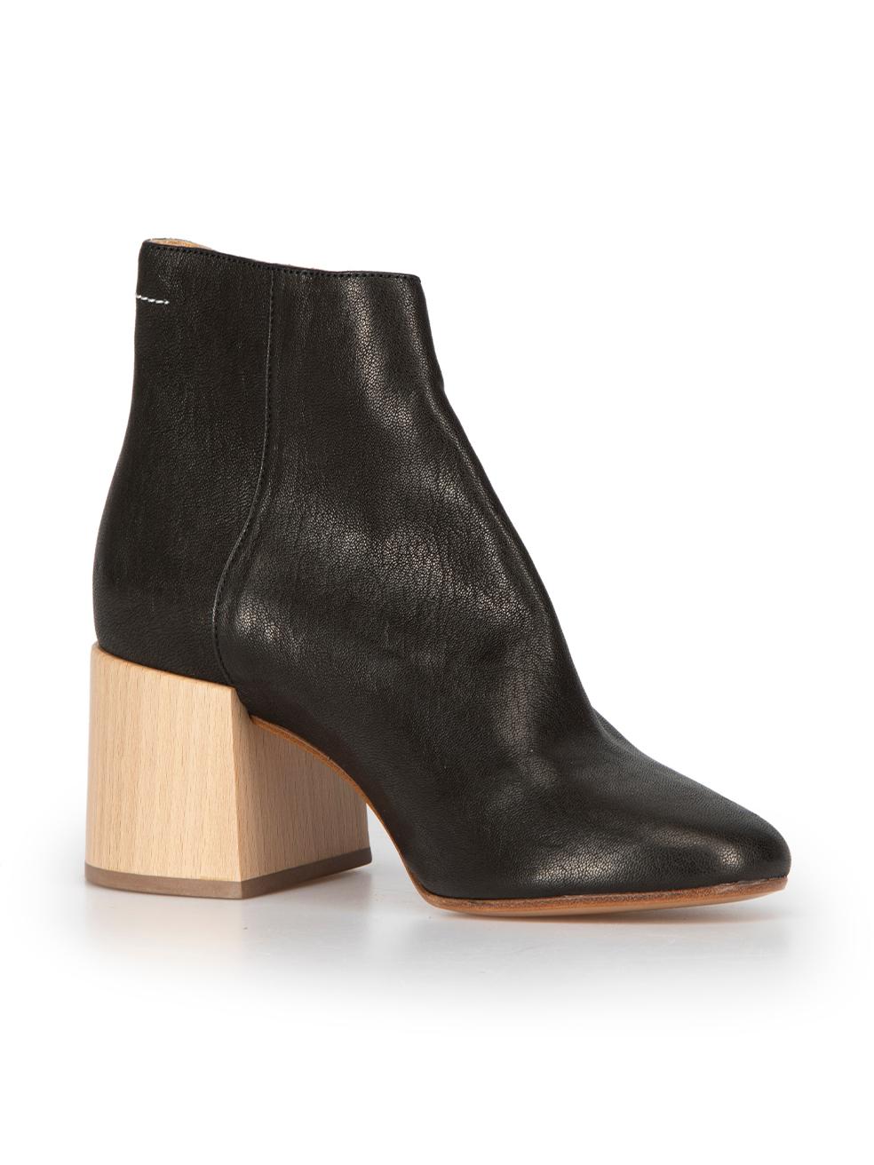 CONDITION is Very good. Hardly any visible wear to boots is evident on this used MM6 Maison Margiela designer resale item. This item comes with original dust bag.



Details


Black

Leather

Ankle boots

Cut out accent

Round toe

Mid wooden block