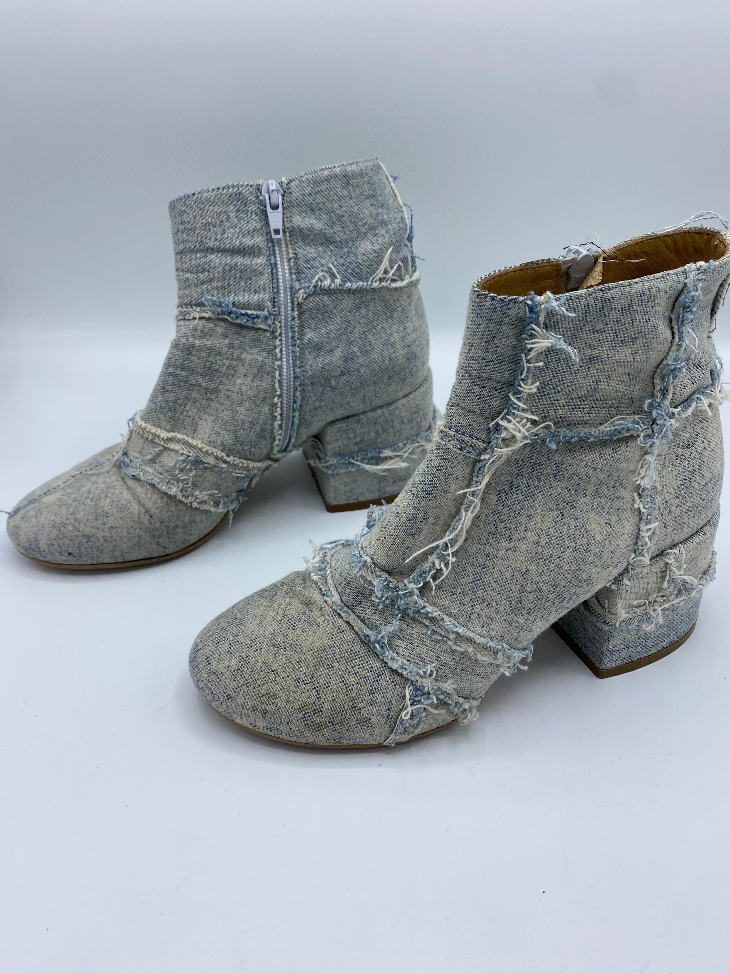 Product details:

The boots feature light wash denim, zip closure and low wide heel, heel height is 3 inches. Made in Italy.