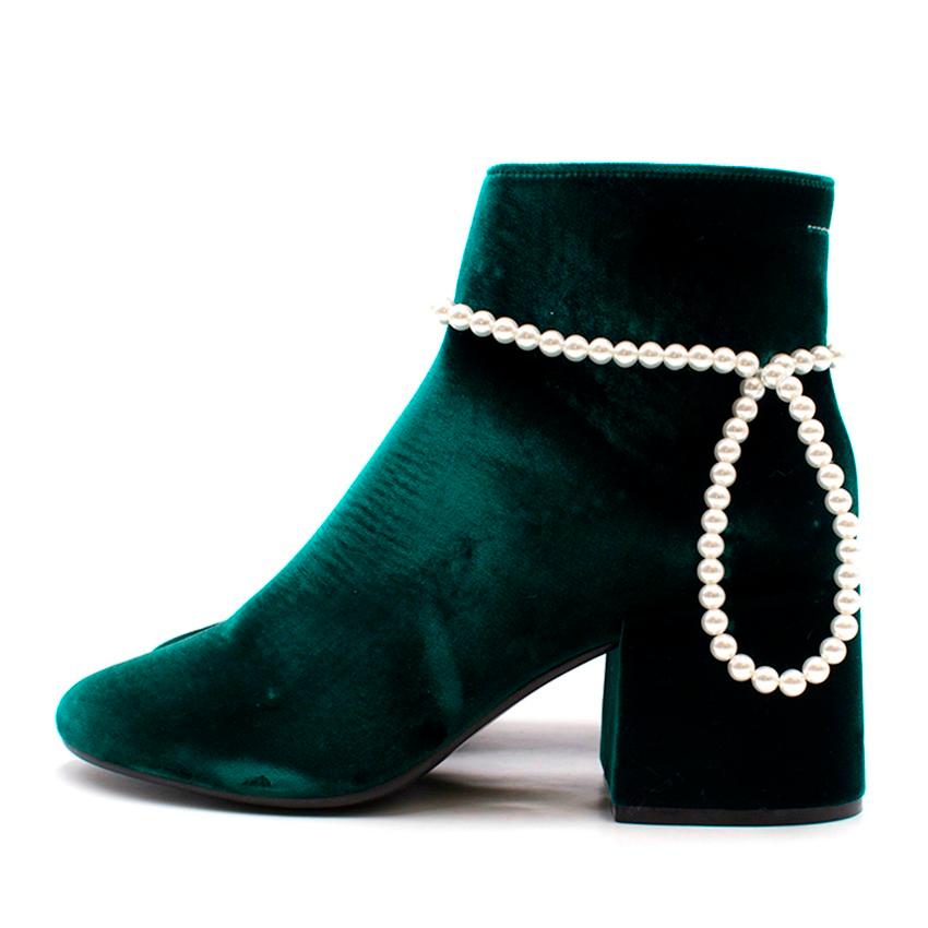 MM6 by Maison Margiela Embellished Velvet Ankle Boots

- Ankle boots
- Velvet
- Leather sole
- Leather lining
- Made in Italy
- Zip fastening along side
- Round toe
- Stacked heel
- Bead embellishment
- Faux pearl

Please note, these items are