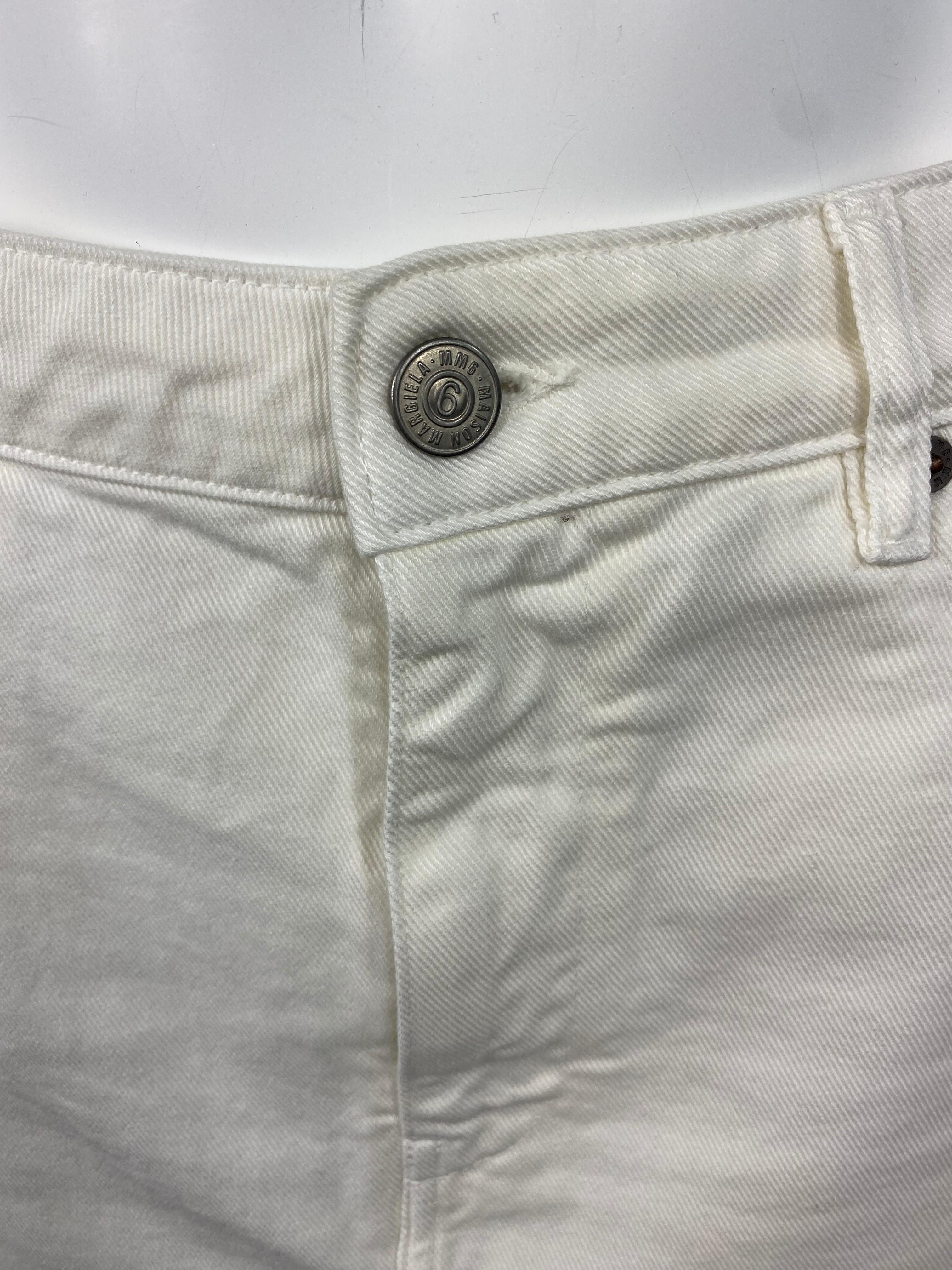Product details:

Featuring white cotton denim pencil skirt, mid length with slit on the back and dial pockets on the front and back.
Made in Italy.